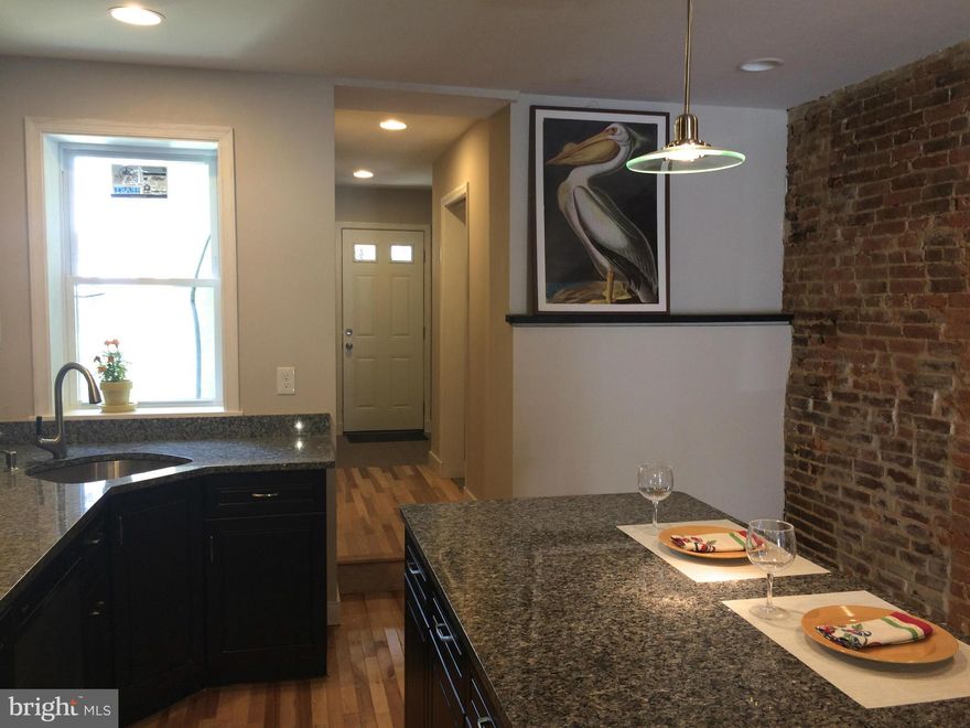 Come take a look at this newly renovated Station North home. Three bedrooms, two full baths, roof deck with great views, new windows and exterior trim, hardwood floors and exposed brick on every floor. Check out the floor plans for details. Finishing touches happening now - see it while it's coming together.  One year builders warranty. JHU LNYW