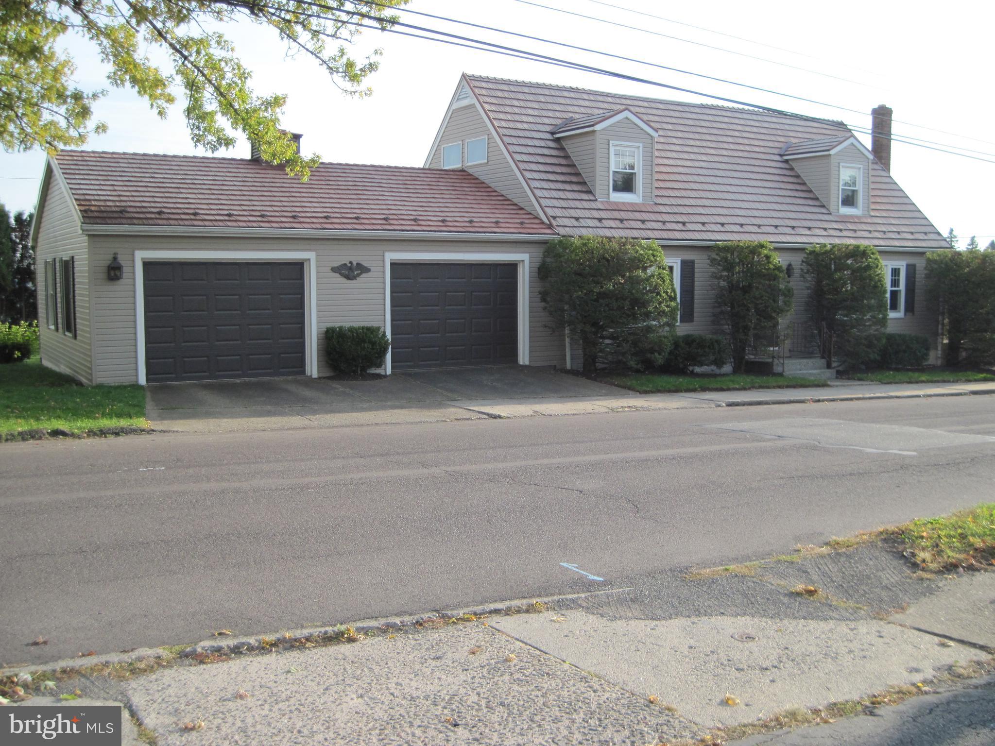 Charming 3-4 BR Cape with three 3/4 baths on a corner lot with over 2400 sq. ft. living space. with attached 31 x 26 oversized 2 car heated garage. New kitchen cabinets, granite tops, plank flooring and appliances just added 2 months ago. Large gathering room features decorative hardwood floor and built-in cabinets and bookshelves . Modern 3/4 tiled bath with 5' tiled shower. 1st floor has hardwood floors and two additional rooms that were used as bedrooms, but one is ideal for a computer room. 2nd floor has 2 large bedrooms, the largest being 14 x 20 with an alcove and built in cabinets and bookshelves. A modern 3/4 bath with large 2 seat shower stall separates the 2 bedrooms and hallway. Lower level with family room , modern 3/4 bath, and separate laundry room, plus a workshop, storage or room for expansion. 3 zone hot water heat. Bonus: Decorative metal roof that still appears as new.