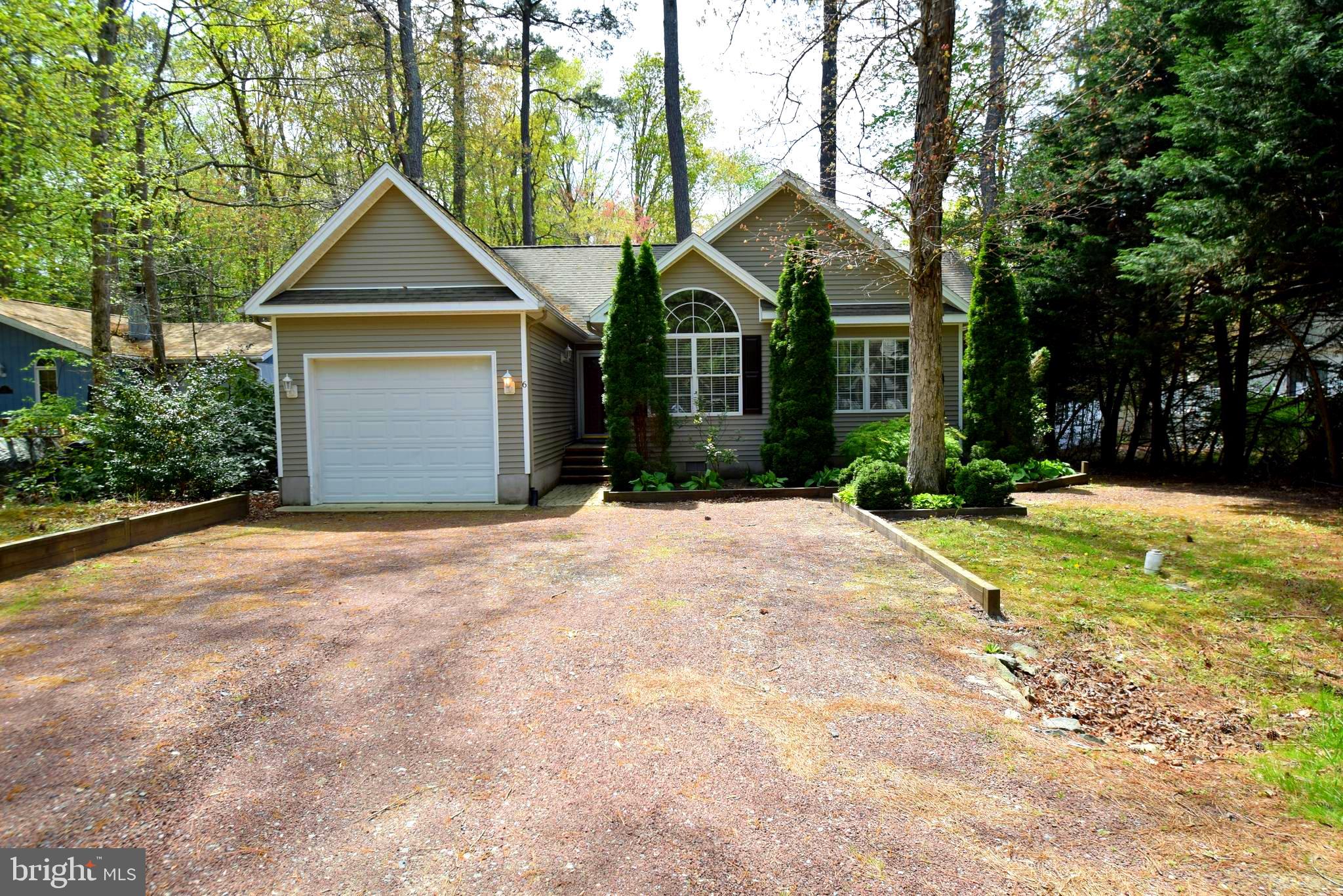 This move in ready home in South Ocean Pines is located on a quiet cul-de-sac. It features a cozy living area with cathedral ceilings and a fireplace, a huge master bedroom with a shelved walk-in closet and large master bath. Relax in privacy on the screened in back porch. A garage completes the package. Schedule your showing today!
