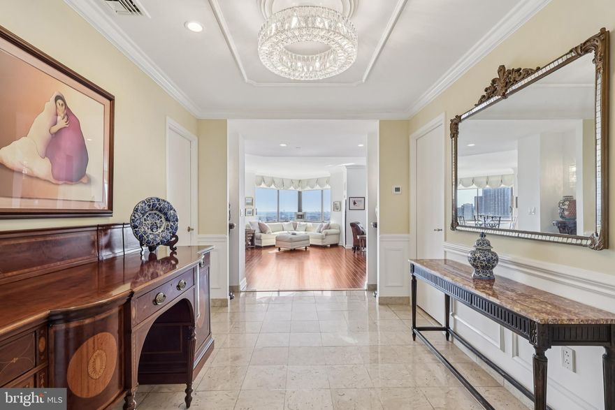 MOST SOUGHT AFTER FLOOR PLAN in The Rittenhouse Hotel and Condominium! Perched on the 25th floor with sweeping views of iconic Rittenhouse Square from every room, this 3-bedroom, 2.5-bath, 2,160 sq. ft. residence offers unmatched views and sophisticated spaces for both everyday living and entertaining.

The showstopping open-concept living, dining, and kitchen area is framed by a wall of windows that fill the home with natural light and spectacular views of the Square and city. The recently renovated chef’s kitchen is a true centerpiece, featuring a large island, expansive countertops, two beverage refrigerators, Sub-Zero refrigerator, Café appliance package, and exceptional storage.

The primary suite is a serene retreat with three closets—including two walk-ins—and custom built-in dressers, along with a beautifully renovated marble bathroom. A third bedroom has been opened to the living room, creating a spectacular den or expanded entertaining space.

Additional highlights include a large custom coat closet, dedicated laundry/utility room, new flooring, and four HVAC systems all replaced in 2019. The home is designed with abundant closets, built-ins, and storage throughout.

Be forever on a vacation with world-class services and amenities: acclaimed restaurants including Lacroix and The Library Bar, chauffeur-driven Mercedes S-Class, five-star concierge services (including dog walking), valet parking, housekeeping, room service, The Rittenhouse Spa & Salon, indoor pool, and fitness center. A private resident’s lobby and 24-hour desk attendant ensure both convenience and security. (Some amenities, such as parking, carry additional fees. The building is non-smoking.)