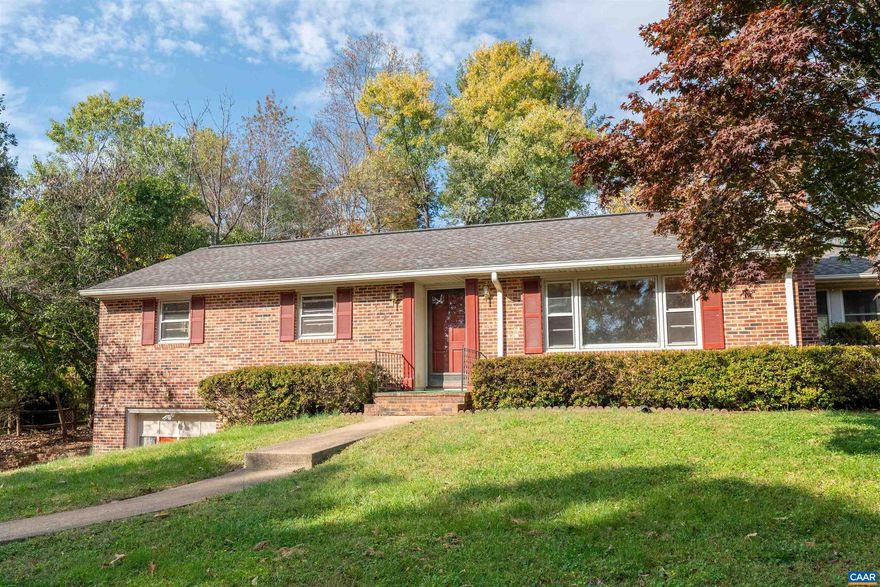 Beautiful brick ranch with 3 bedrooms and 1.5 baths in the Heart of Crozet! Large 0.4 acre flat lot. You'll love the back patio and mature trees. Hardwood floors throughout the main level and two fireplaces, one gas and the other wood burning. There's a finished basement and a one-car garage. You can walk to Downtown Crozet, schools, restaurants, and coffee shops. There's so much potential in this house! It's ready for the next owner to put their stamp on it! Additionally, the adjacent lot can also be purchased for $150,000, totaling 0.75 acres. See Lot 19, Oak Dr for more information. Roof - 2006, HVAC - 2012, county installed new water lines this year, road is being freshly paved soon, gutters replaced, invisible fence installed.,Formica Counter,Wood Cabinets,Fireplace in Basement,Fireplace in Living Room