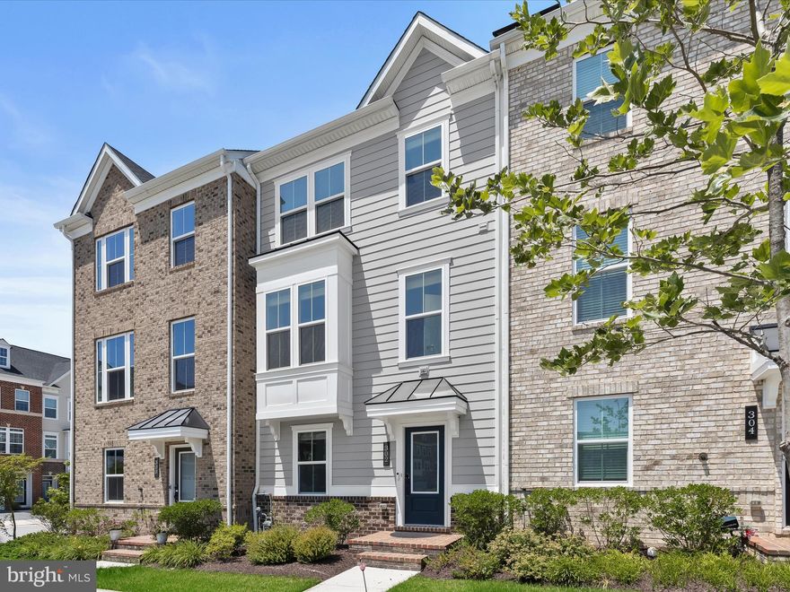 ***This listing is still in a valid listing agreement with the agent. If you have questions, please contact the listing agent.***

If you're dreaming of a new home without the wait of new construction, this stunning 4-bedroom, 3.5-bath townhome with a 2-car garage steps away from open green space is ready to welcome you. The entry-level offers immediate functionality with garage access and a private bedroom suite—complete with its own full bath, perfect for guests or multigenerational living. Upstairs, the main living level is the heart of the home. An open-concept layout is enhanced by a modern, neutral color palette and luxury vinyl plank flooring. The sunlit living room flows seamlessly into the gourmet kitchen, which features stainless steel appliances, granite countertops, 42” cabinetry, a walk-in pantry, and an impressive 8’ center island with a built-in sink. Just off the kitchen, the dining area opens to a composite grilling deck for preparing charbroiled delights. A convenient powder room completes this welcoming level.  On the upper floor, retreat to the serene primary suite with plush carpeting, a sophisticated tray ceiling, walk-in closet, and spa-inspired en suite bath featuring a soaking tub and a walk-in ceramic tile shower with bench seating. Two additional bedrooms, a full hall bath, and a laundry area complete this level. Enjoy the vibrant lifestyle of the sought-after Greenleigh community, which offers a clubhouse, fitness center, outdoor pool, pocket parks, and walking trails. With quick access to I-695, I-95, and the extensive shopping and dining options at White Marsh, this home offers both comfort and convenience.