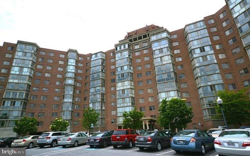 Buyer pays no condo fees through December 2026, as the seller will cover all monthly fees during this period—an exceptional financial advantage for the next owner.
This spacious and beautifully maintained residence is the highly desirable Model K and offers approximately 1,490 square feet with 2 bedrooms, 2 full bathrooms, and a versatile den/office, making it ideal for the discerning buyer seeking both comfort and flexibility. The generous open-concept living and dining area provides an ideal setting for both entertaining and relaxed daily living. The large table-space kitchen is both functional and convenient, with an in-unit washer and dryer for everyday ease. The primary suite includes a walk-in closet plus an additional closet, along with a spacious bath featuring both a tub/shower combination and a separate walk-in shower. The interior is filled with abundant natural light throughout the day, creating a bright and airy atmosphere that complements the open floor plan and makes the home feel even more spacious and inviting.
This home also includes a large enclosed lanai/sunroom with floor-to-ceiling windows that extends the living space and provides a light-filled retreat that can be enjoyed year-round, enhancing the overall sense of openness and comfort.
Located in Vantage Point East within Leisure World Maryland, the bright, open layout with engineered hardwood flooring throughout and tasteful, cohesive finishes makes this the perfect home!

Recent updates include a new HVAC system, kitchen appliances less than 3 years old, and flooring approximately 5 years old, adding value and peace of mind for the next owner.

Additional features include garage parking space #20 and a separate storage unit #8, providing valuable convenience and extra storage capacity.