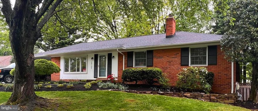 Welcome to this beautifully updated 3-bedroom, 2.5-bath rambler that blends timeless charm with modern convenience. Enjoy an airy open floor plan with refinished hardwood floors, trayed ceiling, recessed lighting, and skylights that fill the home with natural light. The remodeled kitchen features granite countertops, stainless steel appliances, and flows effortlessly into the living and dining areas—ideal for entertaining and everyday living.

Relax in the cozy living area with built-in bookshelves, or step into the screened-in porch just off the kitchen for your morning coffee. The large deck overlooks a beautifully landscaped, fully fenced backyard—perfect for outdoor dining, gardening, or play.

Downstairs, the finished lower level offers new carpet, a gas fireplace, additional built-ins, a half bath, and a convenient walk-out to the backyard.

Additional highlights include remodeled baths, extensive landscaping, a carport, and quality upgrades throughout. This home offers the ease of main level living with versatile space below.

Don't miss this move-in-ready gem