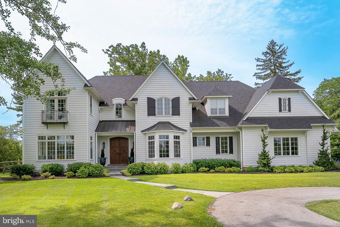 Up a long, tree-lined driveway in Chester County stands a grand home that is literally a stone's throw from all of Devon's best and favorite attractions. Thoughtful deviations from its original design have made this Windsor Model built by Bentley Homes a true masterpiece. Each alteration, upgrade, modification, feature, and fixture was selected with meticulous attention to detail. Architectural and aesthetic themes flow from the exterior grand front entrance and cascade throughout the interior in unique ways, and are included in even the unfinished lower level spaces, garage, and driveway.
Please click on the Matterport Link to walk through the house virtually.
The entire house is filled with upgrades from ceiling heights, flooring, lighting, appliances, tile, moldings, etc. and has exclusive features like a heated driveway, extra tall garage doors, a smart home security and entertainment system, and SO MUCH MORE.
This five bedroom home has four full bathrooms, all with heated floors, and includes two powder rooms on the main floor and one on the lower level. The Master bedroom has a separate sitting area that welcomes you into the bedroom which features an extraordinary chandelier mounted on a grand medallion in the center of the custom-designed tray ceiling. A balcony and two windows offer expansive views of Devon. A long hallway with walk-in closets on each side, both with pocket doors, leads to the magnificent Master Bathroom, which boasts a most beautiful and unique bathtub carved from one solid piece of granite, along with a six by six foot steam shower and multiple faucets. There are two large vanities and a private water closet with a bidet and power flush toilet.
In addition to the other four bedrooms and three bathrooms on the second floor are the laundry room with plenty of cabinet space, a linen closet, and a second staircase that leads to the family foyer on the main level.
Upon entering the formal foyer through the custom African Mahogany double doors, a grand staircase with upgraded treads, railings, and balusters welcomes you. To the left are the study with custom built cabinets and shelves, and the living room which opens to the conservatory through two sets of operational French doors. To the right is the dining room with beautiful picture frame wainscoting. It can also be accessed from the butler's pantry which has wine refrigerator, ice maker, and sink, and connects to the impressive kitchen which boasts a Wolf 60" gas range, a SubZero 48" side by side refrigerator, and so much more. The breakfast room has abundant light and is adjacent to the family room, which has the same custom designed ceiling as the Master bedroom as well as two sets of operational French doors that lead to the outdoor flagstone family room that has multiple high hats, built-in speakers, a television, and a wood burning fireplace.
The lower level is a phenomenal finished space that has many areas for different activities. You can watch a movie, play pool, play just about any game you want, work out in the exercise room that has advanced Edge Sports Flooring and two televisions, have drinks at the bar...... One of the unfinished spaces has an egress through two solid steel doors that are 6'0" by 6'8" in overall size that make storing pool equipment and patio furniture a breeze, in addition to moving any large items in and out of the house.
This home is truly magnificent and while it is just 1/3 mile from the Devon Train Station, it has complete backyard privacy and because it is set atop a long driveway, it is a peaceful oasis in the middle of all that the fabulous town of Devon has to offer. An absolute "must-see to believe!"