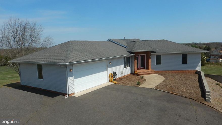 JUST REDUCED!! Open Floor Plan flows from Fam Rm to Kitchen. Design inspired by "Frank Lloyd Wright."  Private setting over 2 acres in back of Cul-de-sac. 3 bdrms on the main floor.  2 addtl. Rooms fin in the bsmnt with full size windows plus full bath (space is not included in finished sq ft). Unfin space in bsmnt can be fin into Rec Room or used as Workshop/Storage. NO HOA! Conv. to Rt 29