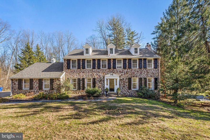 Showings Start Wednesday 2/22/2023. Nestled in a scenic section of sought-after Radnor Township, this well-maintained, beautifully renovated stone-front colonial boasts a bright and open floor plan, fresh paint throughout and a sprawling greenspace that backs to Saw Mill Park. From the side driveway, a stone path leads to the front entry. Inside, the newly expanded and renovated first floor boasts amenities galore, including hardwood floors, custom built-ins and moldings, oversize windows and an effortless flow. Just off the foyer sits a sunny front dining room that opens to the sparkling eat-in kitchen and family room, both of which were part of a grand home addition completed in 2021. The stunning chef’s kitchen makes meal prep and entertaining a breeze with its high-end appliances—including a Wolf® range—center island with seating for six, inset cabinetry and expansive picture window with custom bench below. The kitchen seamlessly connects to a bright and airy family room with gas fireplace, floor-to-ceiling built-ins and elegant beverage station with sink and separate ice and wine fridges. A screened-in porch with Trex® flooring, ceiling-mounted heaters and stairway access to the backyard sits directly off the kitchen-family room area. The other side of the home’s main level boasts a large living room with gas fireplace and light-filled first-floor office accessed via sliding French doors. A mudroom with custom cubby storage (adjacent to the attached, two-car garage!), renovated powder room and laundry room complete this splendid first floor. The amenities continue upstairs, where you’ll find three spacious secondary bedrooms, two renovated hallway baths and a primary suite with ensuite full bath that was expanded and fully renovated in 2021. The current owners spared no expense outfitting the ensuite bath with high-end touches like marble tile, oversize shower with rain head and frameless glass door, soaking tub and separate water closet. The bath also connects to a generously sized walk-in closet. Additional relaxation and play space await in the walk-out lower level with bar area and convenient access to the rear brick patio and tree-lined private greenspace beyond. Located in the rolling hills of Radnor Township yet just minutes from downtown Wayne and major commuter routes, this lovely home is zoned for nationally ranked Radnor Township School District. New roof and two-zoned HVAC installed in 2021.
