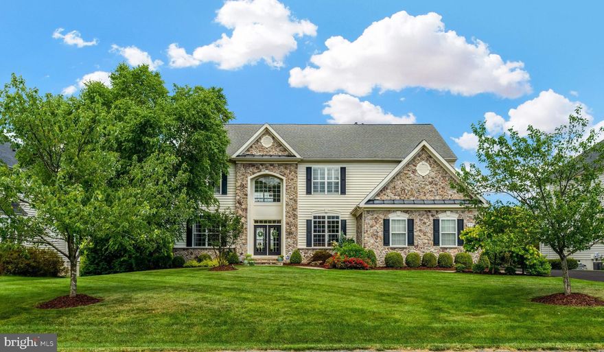 Experience luxurious estate living in Ashburn’s exclusive Belle Terra neighborhood. Zoned for Waxpool Elementary, Virginia’s #1 ranked elementary school according to Niche! Discover over 6,400 square feet of finished square feet overlooking a luscious half acre of green space. The stunning stone exterior and mature landscaping of this residence welcomes you to a grand two-story entrance with curved staircase. Adjacent to the foyer is a convenient main-level bedroom complete with its own en-suite bathroom. The two-story family room with floor to ceiling windows showcases a stone fireplace and seamlessly connects to the gourmet kitchen, equipped with new stainless-steel appliances and oversized island. Adjacent is the morning room, offering a delightful space to enjoy meals while overlooking the expansive backyard. Just off the morning room is an expansive trex deck with gas grilling station ideal for entertaining. Completing the main level are elegant formal living and dining rooms with architectural touches including crown moulding and a convenient half bathroom. Take the rear staircase to the upper level, where you'll discover three generously sized secondary bedrooms and two bathrooms. The primary bedroom oasis includes a sitting area with gas fireplace, walk-in closet with professional organization system and luxurious primary bathroom with dual vanities, spa shower and oversized soaking tub. The fully finished walk-out basement boasts an expansive recreation room offering endless possibilities, a theater room complete with a screen for enjoying the latest movies, and wet bar with beverage refrigerator. Additionally, there's a sixth bedroom and a full bathroom, ideal as an au pair or guest suite. From the basement, step out onto the covered deck featuring an outdoor television and gas fireplace, creating an ideal setting for cozy fall evenings and Sunday football gatherings. Just minutes away from Brambleton Town Center offering shopping, dining, and a movie theater. Conveniently situated near Dulles Airport, Routes 267 and 50, and Loudoun Metro Station. Updates include newer appliances, brand new washer/dryer, newer AC and freshly painted recreation room. Lawn service included in monthly rent. Don’t miss this exclusive opportunity!