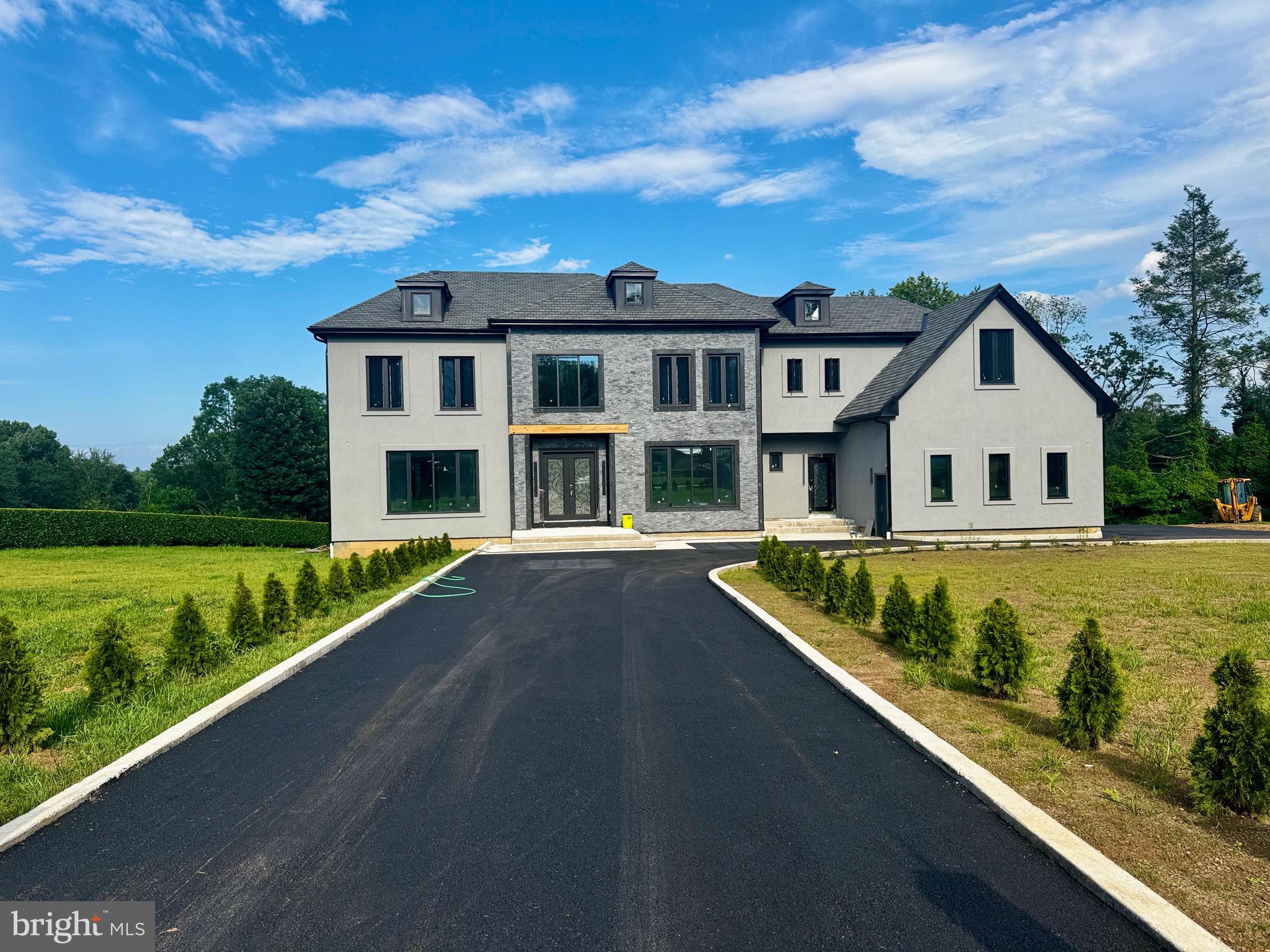 Welcome to 1047 Welsh Road – A New Construction Home in Prestigious Lower Moreland Township.
Introducing the latest addition to Lower Moreland’s luxury real estate market: 1047 Welsh Road.
Nestled on over 1.4 acre of land, this modern residence blends contemporary architectural design with timeless craftsmanship, offering living in one of the area's most sought-after LOCATIONS.
The new owners will have the exciting opportunity to personalize the design of the basement, as well as the landscaping and the pool area, allowing for a tailored living experience that meets their unique vision.
Designed for the refined buyer, this custom-built home features a striking exterior with dramatic dark accents and meticulously curated details throughout. Step inside through a grand foyer that leads to an open-concept floor plan featuring rich hardwood flooring and an elegant central staircase.
The living room is bathed in natural light along with two floor to ceiling marble fireplace, creating a warm yet sophisticated atmosphere. Adjacent to the living room, the formal dining area flows seamlessly into the heart of the home—an exceptional gourmet kitchen. Here, you'll find two massive center islands, custom cabinetry, quartz countertops, and top-of-the-line stainless steel appliances—all designed to impress and perform.
The main level also includes a private study, access to a spacious three-car garage, and two full bathrooms for added convenience.
Upstairs, anchors four generously sized bedrooms, each with access to its own full bathroom. The primary suite is a true retreat, offering two walk-in closets and a spa-inspired bathroom featuring his and her vanities, a freestanding soaking tub, a walk-in shower with custom glass enclosure, and high-end finishes throughout.
The finished lower level (vanilla box) includes flooring, electric, and drywall, offering a blank canvas ideal for a home theater, fitness center, game room, or guest suite. A private entrance provides added flexibility and convenience.
Out back, you'll find an outdoor space that feels like a private resort—complete with a sleek all-glass pergola, a fascinating custom pool, a spacious patio, and beautifully designed landscaping that ties it all together. It’s the perfect spot for summer entertaining or quiet evenings at home.
Crafted in collaboration between a distinguished architects and experienced builder, this home exemplifies luxury, quality, and thoughtful design.
Don't miss your opportunity to customize and own this extraordinary home in Lower Moreland Township.
Call the listing agent to discuss the available options for customization.
Photos shown are renderings and design plans for 1047 Walsh Road
This new construction is not completed yet.