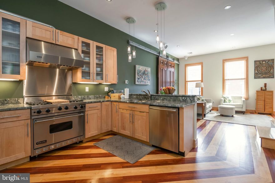 Located on one of the most picturesque streets in the Spring Garden Historic District, this absolutely stunning 2-story, 2 bedroom, 2 bathroom condominium home includes deeded garage parking and a new Trex rooftop deck with outstanding center city views. This exceptional home was the developer’s personal custom built residence featuring many impressive upgrades. The home features an open floor plan with beautiful walnut & natural oak hardwood floors. An outstanding chef’s kitchen with 42” maple cabinetry, exquisite granite counter tops and premium grade stainless steel appliances: Viking freestanding range & ventilation, Bosch dishwasher and built-in GE Monogram refrigerator. The breakfast bar is open to a large sun-filled living room as the main space presents 11’ ceilings, 3 tall south facing windows, and recessed LED lighting. In addition, both the first & second levels are hard-wired with a Bose surround sound system. The staircase with sleek cable spindles leads you to the spacious master bedroom suite with three large windows, two double closets, and city-views. The fabulous master bathroom entails a stylish glass-top vanity, an oversized shower with dual shower heads and a glass tiled floor. The second bedroom is generously sized with a large closet & storage space. The hall bathroom is designed with Travertine floors and a floating vanity. Additional features include a laundry room with full sized stackable washer/dryer and a large storage bin with shelving. An energy efficient heater/ac system and water heater were added in 2021 and a new roof in 2020. Additional personal storage space is provided in the basement. The home is a short walk to the Museum of Art, the Barnes, and Fairmount Park and is a pleasant walk to center city as well. Whole Foods and Target are just blocks away along with many noteworthy restaurants. The area has a walk score of 96, transit score of 82 and bike score of 93. And for man’s best friend, the Green Street Dog Park is less than a block away.  This home will not last!!