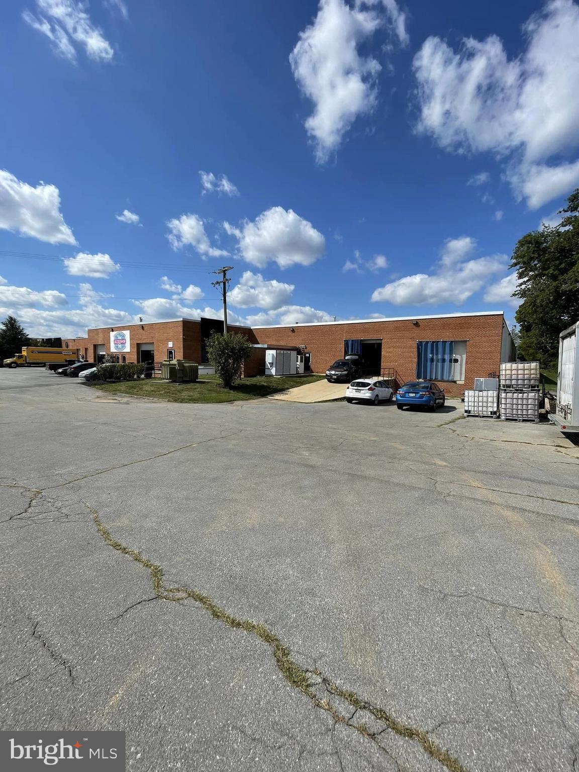 Currently a Distillery.  Large Open Warehouse Space with 1 Dock Door, 1 Drive-In Door.  Doors have Electric Roll-Up Door, Three Phase Electric & Shared with one other Tenant Separate Mens and Womens Restrooms. Adjacent to Frederick Airport.