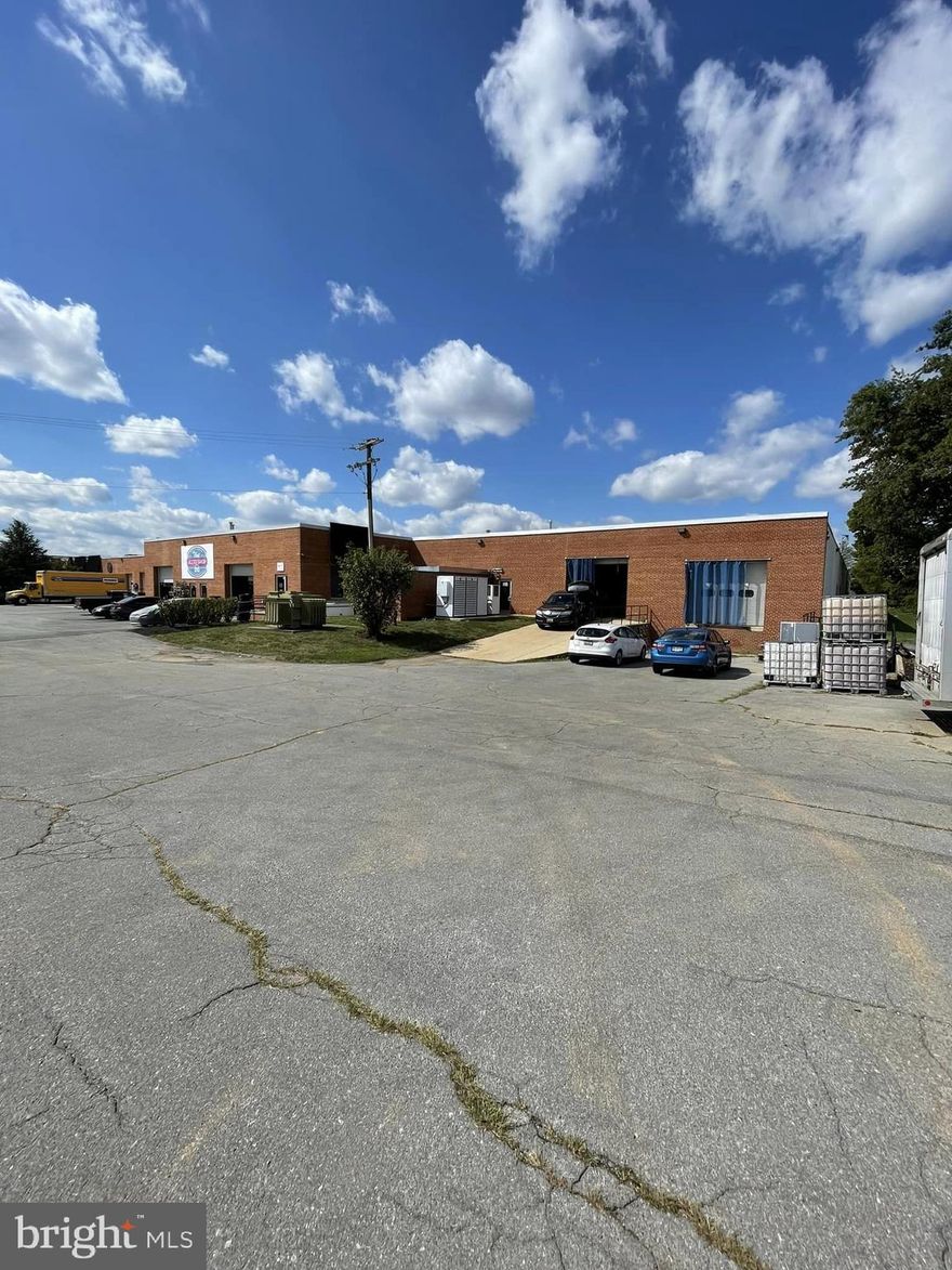 Currently a Distillery.  Large Open Warehouse Space with 1 Dock Door, 1 Drive-In Door.  Doors have Electric Roll-Up Door, Three Phase Electric & Shared with one other Tenant Separate Mens and Womens Restrooms. Adjacent to Frederick Airport.