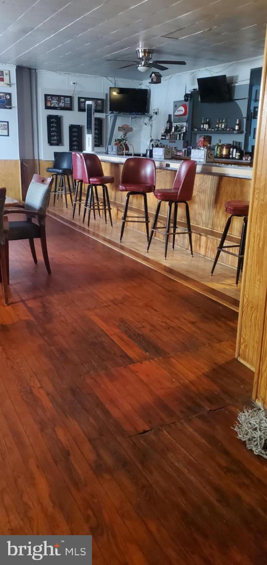 Address includes 349 + 351 S Calhoun St. Real Nice Bar, license, and all equipment included, Open 7 days.  Two more floors of usable space for additional income  + two storefront offices with an attached one car garage. A Great opportunity to operate a multi use building. All inquiries must be able to show proof of funds to schedule a full look.