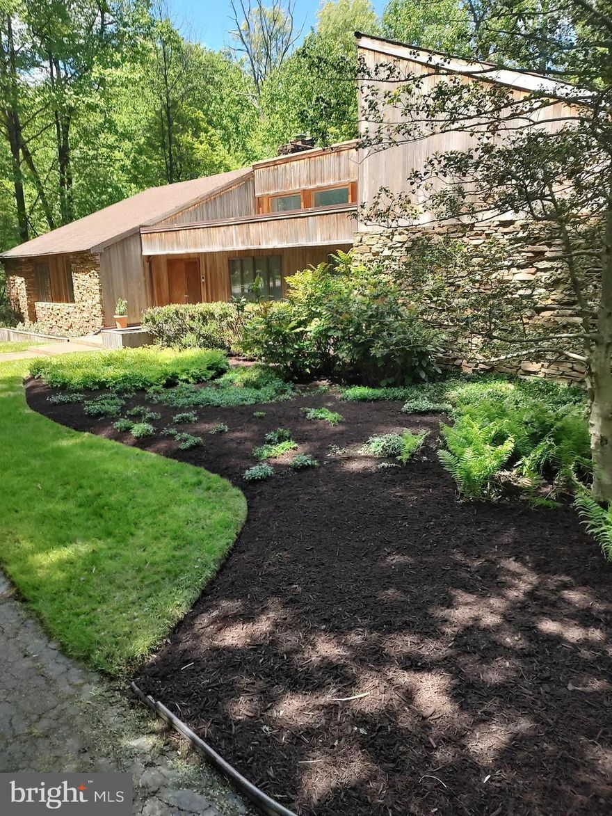 ** Rates stopping you from buying? Ask your agent/lender about negotiating a 2/1 buy down in the offer**
Welcome to this gorgeous contemporary 5 Bed, 3.5 bath home on 1.4 acres in the highly desired Velvet Valley neighborhood just outside of Pikesville, Garrison and Owings Mills.  Pull into the drive through arc driveway, park on the large parking pad or pull into the two car attached garage.  The lanscaping is beautiful and this custom built California style home is situated on 1.4 wooded acres.  There is a large wood deck and walkway/ramp overlooking the backyard.  The inside of the house is completely custom, with built-ins, trim work and modern design throughout.  The attention is in the details!  There are four bedrooms on the first floor including a large owners suite with its own large full private bath w/ stand up shower and soaking tub, as well as it's own private office.  There is another full bath in the hallway with the bedrooms, and a half bath near the garage.  There is a family room and a living room both with high vaulted ceilings split down the middle by and accent windows for the perfect light filtration.  The modern kitchen has top of the line appliances, a massive sub zero fridge, wall ovens, built in office space, large granite kitchen island and other upgrades.  The kitchen shares space with an open concept dining room with sliders that open out onto the rear deck.  A hallway off of the kitchen takes you to a laundry room, and a half bath, as well as the garage.
The massive basement includes two more living spaces, tons of storage, another bedroom and full bath, and a huge living/entertainment area with more custom built ins including a bar complete with its own sub zero fridge and instant hot water.  Two more sets of sliders off of this area walk out to the rear patio.  This home is dual zoned with an HVAC that is only 5 years old and comes with a new hot water heater.  Gorgeous custom living in another world just moments away from the city, come see it today!