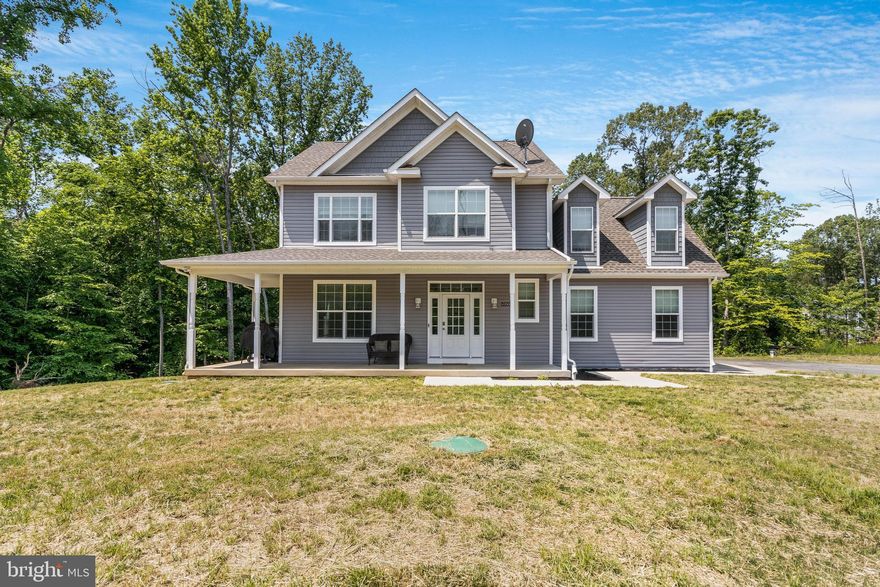 Price Improvement! Newer construction without the wait! This stunning 2021 build offers a spacious and luxurious living experience on a sprawling 3.47-acre lot. Boasting 4 bedrooms, 2.5 bathrooms, and an abundance of quality features, this home has everything you need for comfortable and stylish living.

The entrance welcomes you into an open-concept living space that is perfect for entertaining guests or relaxing with family. The gourmet kitchen features white cabinetry, stainless steel appliances, and a large pantry. The adjacent dining area offers ample space for sit down meals. The spacious living room boasts a pellet stove fireplace and large windows that flood the space with natural light. The main level also includes a convenient half bathroom.

Upstairs, you'll find a luxurious master suite with a walk-in closet and an en-suite bathroom featuring a double vanity, soaking tub, and separate shower. The three additional bedrooms offer plenty of space and natural light, and share a full bathroom. You can also find the laundry room on the upper level which makes for easy laundry days!

The unfinished walk-out basement with rough-in plumbing offers endless possibilities for customization and expansion. Whether you're looking to create additional living space, a home office, or a recreation area, this space is a blank canvas for your imagination. With its own separate entrance, the basement also offers the opportunity for a potential rental income or in-law suite. The potential for customization and expansion with this space is truly limitless, making this home a fantastic investment for years to come.

Outside, enjoy the picturesque landscape of your private 3.47-acre lot. The property is perfect for outdoor enthusiasts with plenty of space for gardening, recreation, and relaxation. Rest assured, you will always have those beautiful views of woods and trees in your backyard due to a forest conservation easement in place. 

Other features of this stunning home include a beautiful front porch, wiring for invisible fence, recessed lighting, option to lease current water treatment system, central heating and air conditioning, and a two-car garage. Just minutes to La Plata (11 miles), Indian Head Naval Facility (10 miles), Joint Base Andrews (35 miles) and Washington DC/Joint Base Anacostia-Bolling (37 miles). Don't miss out on the opportunity to own this beautiful and meticulously crafted home! **Location even qualifies for USDA Rural Development 100% financing!!**