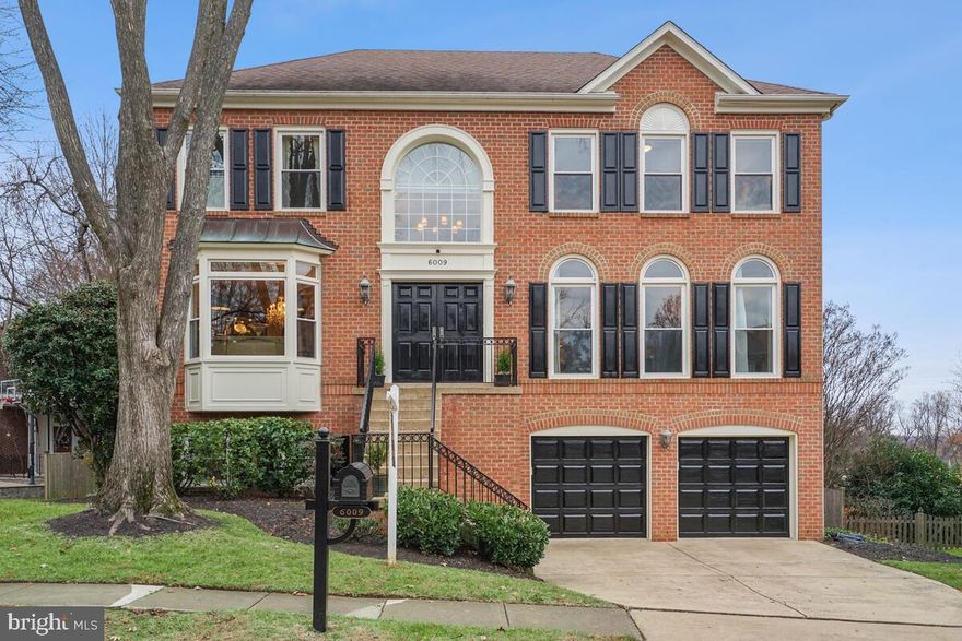 An exceptional North Arlington residence, this five-bedroom, three-and-a-half-bath Colonial exudes elegance with 3,824 square feet of luxurious living space. Tucked away on a cul-de-sac in the sought-after Spy Hill neighborhood, the home offers panoramic views and meticulously landscaped surroundings. Stepping through the grandeur of the two-story foyer, adorned with dramatic arch columns, you'll discover the seamless flow from formal living and dining rooms to the newly renovated gourmet kitchen.

The kitchen, complete with a breakfast room, effortlessly connects to the adjoining family room, showcasing built-ins, French doors leading to a deck, and a cozy gas fireplace. Upstairs, four generously sized bedrooms await, including a sumptuous owner's retreat with a spa-like bath. The lower level is a perfect entertaining space, featuring a walk-out family room with built-in bookcases, an additional inviting gas fireplace, a wine cellar, a full bathroom, and an au pair suite.

Noteworthy features include a two-car garage, a captivating deck with a spiral staircase, and a slate patio perfectly nestled beneath an under-deck ceiling with ceiling fans. Professional landscaping envelops the home, creating a private oasis. Situated on a tranquil street, the residence is surrounded by parks, including Bluemont, Bonair Rose Garden, Upton Hill, and the WO&D trails. Despite the serene setting, you're just minutes from two metros, East Falls Church and Ballston, with convenient access to Route 50 and Route 66, ensuring an easy commute into DC.