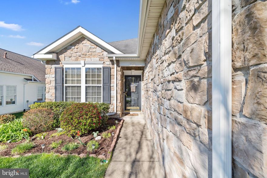 Welcome to 17322 Four Seasons Drive, located in the sought-after Four Seasons community in Dumfries, VA! This beautifully maintained home offers the ease and convenience of one-level living, complemented by thoughtful upgrades, exceptional outdoor features, and great curb appeal.
Step inside to a bright and open floor plan filled with natural light. The spacious living and dining areas are enhanced with custom built-in storage, including deep drawers and a wine rack. Hardwood floors throughout the main living areas, carpet in the bedrooms.
The kitchen seamlessly connects to the main family room and features granite countertops, a stylish backsplash, a large island with functional cabinetry, upgraded cabinets, double wall ovens, cooktop and range, built-in microwave, and a pantry for added storage.
This home offers 3 bedrooms and 2 full bathrooms. The primary suite features a private bath with a soaking tub, walk-in shower, custom built-ins on the double-sink vanity, and generous closet space. The two additional bedrooms share a full hall bathroom, and each bedroom closet has been customized with built-ins to maximize storage. A built-in ironing board is conveniently located near the laundry area.
The laundry room, complete with washer, dryer, and utility sink, is ideally situated just off the two-car garage for everyday convenience.
Enjoy outdoor living at its best with a screened-in porch featuring retractable blinds. Additional exterior features include an in-ground sprinkler system (front and backyard) and a stamped concrete patio. 
This home combines comfort, functionality, and thoughtful upgrades in one of the area’s most desirable active adult communities. Living in the Four Seasons 55+ retirement community offers a low-maintenance lifestyle focused on wellness, social engagement, and leisure. The HOA is designed to take care of common area maintenance and provide access to amenities that promote an active and connected retirement. These amenities include a private clubhouse, fitness centers, indoor and outdoor swimming pools, outdoor courts (pickleball, bocce and tennis), walking and biking trails, and outdoor gathering areas. Don’t miss the opportunity to make this beautiful home yours!