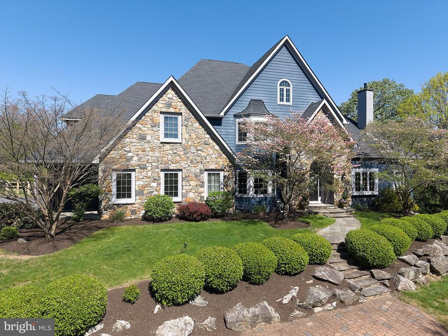 A rare offering in the heart of Chester Springs- just minutes from major roads and highways- this exceptional estate home blends privacy, elegance, and everyday flexibility. Set behind a gated driveway, the approach alone sets the tone for something truly special.  Perfectly positioned on a beautiful two acre homesite, the backyard offers and ideal setting for recreation, entertaining, or simple enjoying the peaceful surroundings and captivating views .  This impressive 6 bedroom home offers a thoughtful blend of timeless design, generous living spaces, and refined finishes throughout. Set on a picturesque lot , the property provides both privacy and convenience.  Hardwood floors extend through much of the home, complemented by detailed millwork and well-designed living spaces. The expansive kitchen features stainless steel appliances, wine refrigeration, solid wood cabinetry, quartzite countertops and a large walk-in pantry. Ample space and casual dining areas make the kitchen both functional and inviting. The main-level primary suite offers a private retreat with two walk in closets and a spacious ensuite bath.  An adjoining office with custom built ins and a gas fireplace provides flexible space for work and relaxation. Upstairs, five bedrooms offer flexible living arrangements, including a private guest or au pair suite, two bedrooms with ensuite baths and a Jack and Jill bath connecting the additional two rooms.  The exterior features usable grounds with open views, offering space for outdoor living and recreation. the 4-car garage provides parking and storage. This extraordinary property located in the Downingtown East School District with easy access to Routes 401 and 202, this home offers a combination of space, setting, and accessibility. Elegant, expansive, and ideally located- this is a home where luxury meets lifestyle in one of Chester Springs most desirable settings.