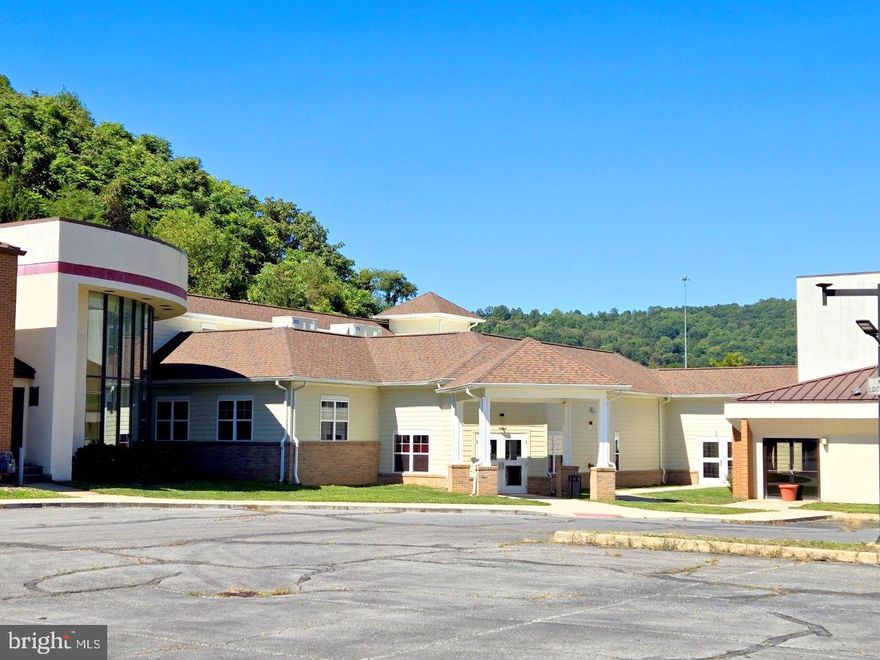 Live & Online Auction held at the property Thursday, May 29 at Noon. Property will be sold at auction, agents will be onsite for property previews on 5/14 & 5/21 from 1PM-4PM. List price required by MLS, but not reflective of the reserve price & is only the recommended starting bid & non-reflective of value. Located just off Interstate 64 in Covington, VA this is a rare offering of an over 64,000 square-foot Memory Care/Assisted Living Facility that has been recently renovated. The property features over 8 acres of land offering room for future expansion (Recently Surveyed), 76 total rooms (35 designated for memory care, 41 for assisted living), a fully equipped commercial kitchen, a fitness center, an entertainment room, & multiple offices. There is a strong need for facilities such as this one, don't miss the opportunity to make this investment!