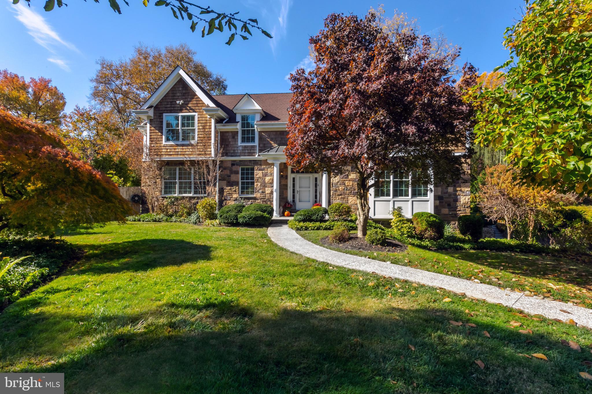 No tricks here, just a treat!! A total of over 5000 above grade sq. feet; between the 4,265 sq. ft upper level & 766 sq.ft lower) , nine years young, re-built in 2013 (new build & low taxes), turn-key, open floor plan home owned by an award-winning professional artist who built this home to reflect her needs as an artist to showcase her work; large, gallery style rooms, oversized windows to allow for an abundance of natural light into every room and the finished lower level was her private gallery where she hosted exhibits & sales. The next lucky homeowner will benefit not only from a new home AND low taxes BUT from this well thought out design, a Capron/MacIntyre collaboration, the result: a modern, well-built home with ample storage, an abundance of closet space in all rooms situated on a very private, quiet cul-de-sac. If you are a multi-generational buyer then you are in luck! TWO OWNERS SUITES; ONE ON THE MAIN FLOOR & THE OTHER ON THE SECOND FLOOR. Both suites have walk in closets and 2 sink bathrooms w/ granite tops and updated fixtures. The 2nd floor suite has 2 walk-in closets and a massive bathroom boasting a separate water closet, an oversized shower w/ rain shower head & double sink granite vanity. The three additional bedrooms on that level also boast walk-in closets & largess in every room. The hall bath has a wall of storage, double granite vanity sinks, and shower/tub combination. This level is carpeted to maintain the quiet & solid feel throughout the home. The first floor, with hardwood floors throughout, is open from the kitchen through to the living areas; a gas fireplace anchors the far side wall from the kitchen. There is a 1st floor home office or family room off the living room; separated by French doors off the foyer as well as access from the living room. Moving from one floor to the next is made easier by an elevator servicing all three levels. There are sliding doors from the kitchen & living room leading out to the patio/pool/backyard. One feels the “outside come in”. Oversized windows allow an abundance of natural light to shine throughout this level. Behind the kitchen is a 1st floor powder room and laundry room boasting a doggie spa that can be shared by their humans to shower off coming in from the pool. There is a door in that room leading to the backyard. A finished lower level boasts an enormous recreational space that was the artists gallery where she held exhibits & sales. You'll find a hallway leading to a 2nd powder room w/ ample space to add a full bath suite & a walk out door to the driveway. There are 2 additional storage rooms on that level. The backyard is shared by the pool; plenty of room to swim and play. A path leading down to the driveway and garages makes for easy transition from the back to the front of the property.
The southwest orientation of the property is outstanding for gardeners & the mature perennial gardens that surround the home. If you love figs you’re in luck! There are mature fruit trees producing figs in season, every season. The Cynwyd Heritage trail & Bala Cynwyd Park are at the end of the street, Mama’s cheesesteaks is down the street & the bus stop is at the corner. Easy and quick access to center city, houses of worship and the Jersey Shore. Grab this gorgeous home before someone else does!!