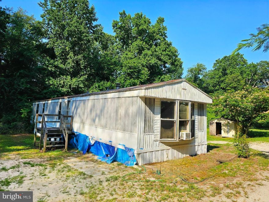 Tucked away on a private 2.25 acres, opportunity awaits! Investors will appreciate the long rental history and potential for renovation and resale. Or build your dream home in a quiet setting that is surrounded by nature where you can immerse yourself in serenity and privacy along the bank of the Walston Branch. This property is the perfect blend of rural living with the convenience of town just minutes away.