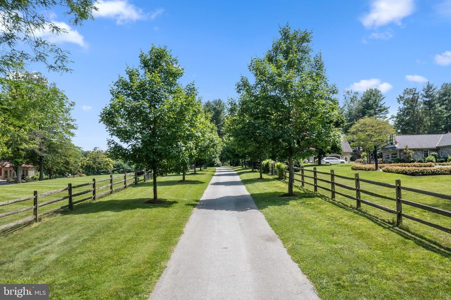This exquisite home and serene property await you through the long allee of   Maple Trees that line the drive.  The privacy afforded by this entrance is extraordinary, as it opens to a fully renovated home on the most stunning 4.6 acres.       No part of this home was left untouched during renovation.  You will enjoy gorgeous reclaimed floors throughout the first floor, custom built-ins, a fully renovated kitchen opening up to the family room, laundry and mudroom off the garage, beautifully renovated bathrooms, finished basement with gym and lots of storage.
Outside you will find the very large bluestone patio is surrounded by cottage perennial gardens and your view is of the large open meadow surrounded by  wildflower fields featuring specimen trees.  Beyond the custom built chicken coop and enclosed raised vegetable garden you will see an established orchard with pear, apple and peach trees.  This owner worked with Refugia Design to create and implement this magnificent landscape.
This house is not just beautiful, it is efficient.  The Geothermal Heating results in extremely low electric and HVAC bills, foam insulation in the basement and crawl space, smart thermostats, wood burning inserts in the fireplace, and insulation in the attic and over the garage space results in a level of efficiency rarely seen.
This extremely private oasis is surrounded by preserved lands, views of horses and big sky!  Close by you will enjoy many places to hike, play,  and walk – Kirkwood Preserve, Okehocking Preserve, Rushton Woods and Farm, Ashbridge Preserve, Serpentine Preserve and East Goshen Park which has sports fields and trails.   In the close by charming town of Malvern, you will find fantastic shops, cafes and restaurants.  Oh perhaps you are in the mood for a sauna after your hike? A stunning barrel shaped sauna sits on it’s very own blue stone patio!  Come and see for yourself- this home and property have everything!!