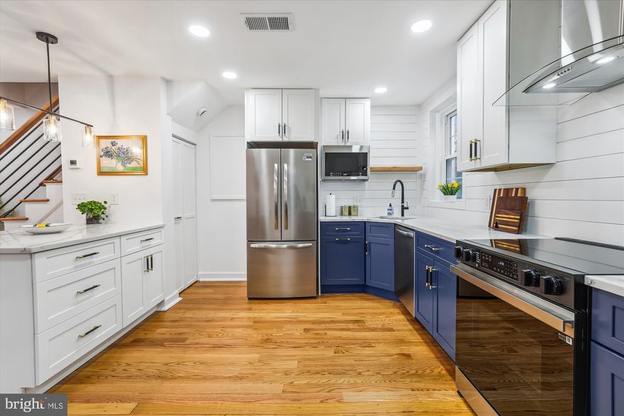 Be the first to live in this JUST remodeled gorgeous end-unit townhome!  Like a New York City flat or a pied-a-terre in Paris, it’s the perfect starter home or the perfect home for empty-nesters and downsizers!   Just the right size with  2 bedrooms, 1 bath and no yardwork.  Chef’s dream kitchen!  It’s big and beautiful with brand new appliances, deep blue base cabinets & white upper cabinets, quartz countertops, a shiplap backsplash, and a large peninsula with breakfast bar.   Smooth ceilings with recessed lighting throughout the large, bright and airy open concept main level. No popcorn!  On the way upstairs, note the modern oak & black iron-rail banister and the gleaming refinished stairs and hardwood floors throughout the home. Open the hallway closet upstairs and you’ll find a stacked washer-dryer making laundry so convenient. A tall linen closet flanks the entry to the blue and grey bathroom, which features gorgeous tile and a glass shower door.

The primary bedroom has a closet organizing system and lots of natural light. The second bedroom has a charming board & batten wall design and newly installed pull-down stairs to an attic for storage. Other home features include a new HVAC (2025) and all new doorknobs, switch plates, & vent covers and new paint.

This Georgetown model located in Fairlington Villages comes with two parking stickers and neighborhood amenities that include six pools, many lighted tennis courts, tot lots/playgrounds, walking paths, & MORE!  Great location near I-395 & the shops and restaurants of popular Shirlington, West Alex & Old Town Alexandria. This home was loved and well-maintained by one owner for 32 years then remodeled from top to bottom in 2025 with the latest upscale designs.