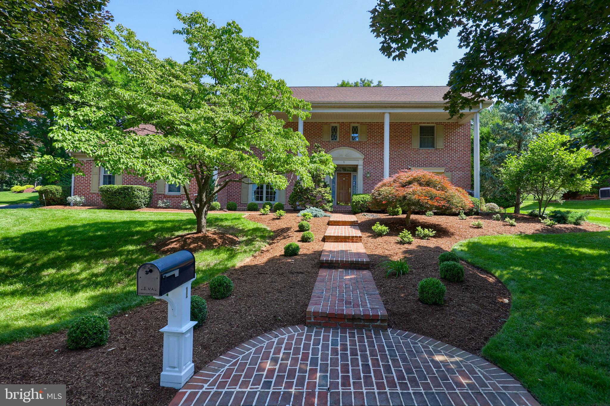Classic Elegance & Outdoor Entertainment in Wyomissing’s Birdland
Nestled in the heart of Wyomissing’s beloved Birdland on a massive corner lot, this distinguished brick home offers timeless curb appeal, beautifully framed by manicured landscaping, brick walkway and covered front porch, and a classic columned entry.
Step inside to a dramatic two-story foyer where a graceful spiral staircase pulls you in — setting the stage for an elegant open flow through several French doors and high-end touches in every room. A formal dining room with crown molding, hardwood flooring, and large bay front window, make entertaining a joy — whether it’s intimate dinners or holiday celebrations.
Formal spaces are rich in character, from the cozy living room with a wood-burning, brick fireplace with a decorative wood surround and large bay front window to a sunlit office wrapped in custom built-ins and accented with wood beams and bay windows.
The heart of the home lies in the open-concept kitchen and family room, where there are dual islands, new stainless steel appliances and quartz countertops, maple cabinetry, and a breakfast room with tile-front fireplace that flows naturally to the main living space.
The spacious family room is warm and inviting, offering a stunning floor-to-ceiling brick fireplace, custom built-ins, and a massive sunlit bay window.
Upstairs, the luxury Master Suite offers double glass doors to the private balcony, dual closets, a large sitting room, and a spa-like en-suite bath with His & Hers vanity, backlit mirrors, a tile Whirlpool tub, and waterfall shower — the perfect way to end the day.
Three additional bedrooms boast their own unique character, complete with thoughtful built-ins and spacious closets, as well as one with a built-in desk and another with a walk-in. A separate, second--level bonus game room with mirror wall and vaulted ceilings are perfect for play or creative space.
The huge finished lower level adds even more versatility for both relaxing and entertaining with a full kitchenette, both tile and carpeted living spaces, a powder room, and Bilco door access to the outside.
In the backyard, a show-stopping two-tier paver patio surrounded by stone retaining walls awaits — complete with a built-in firepit, grill island with granite counters, a pergola-covered lounge area, and expansive lawn space for relaxing or entertaining.
Enjoy plenty of storage with both a 1-car and 2-car attached garage, a shed out back, and an attic space accessible through the fourth bedroom.