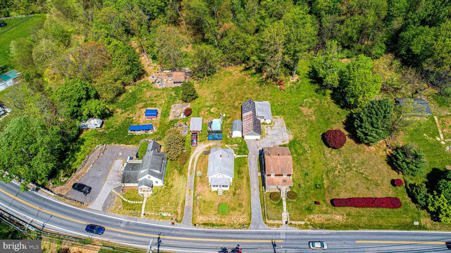Development potential. Property consists of three parcels for a total of 9.27 acres zoned DR 3.5. Two of the three dwellings are presently occupied and will only be shown during a study period. Please call for details.
