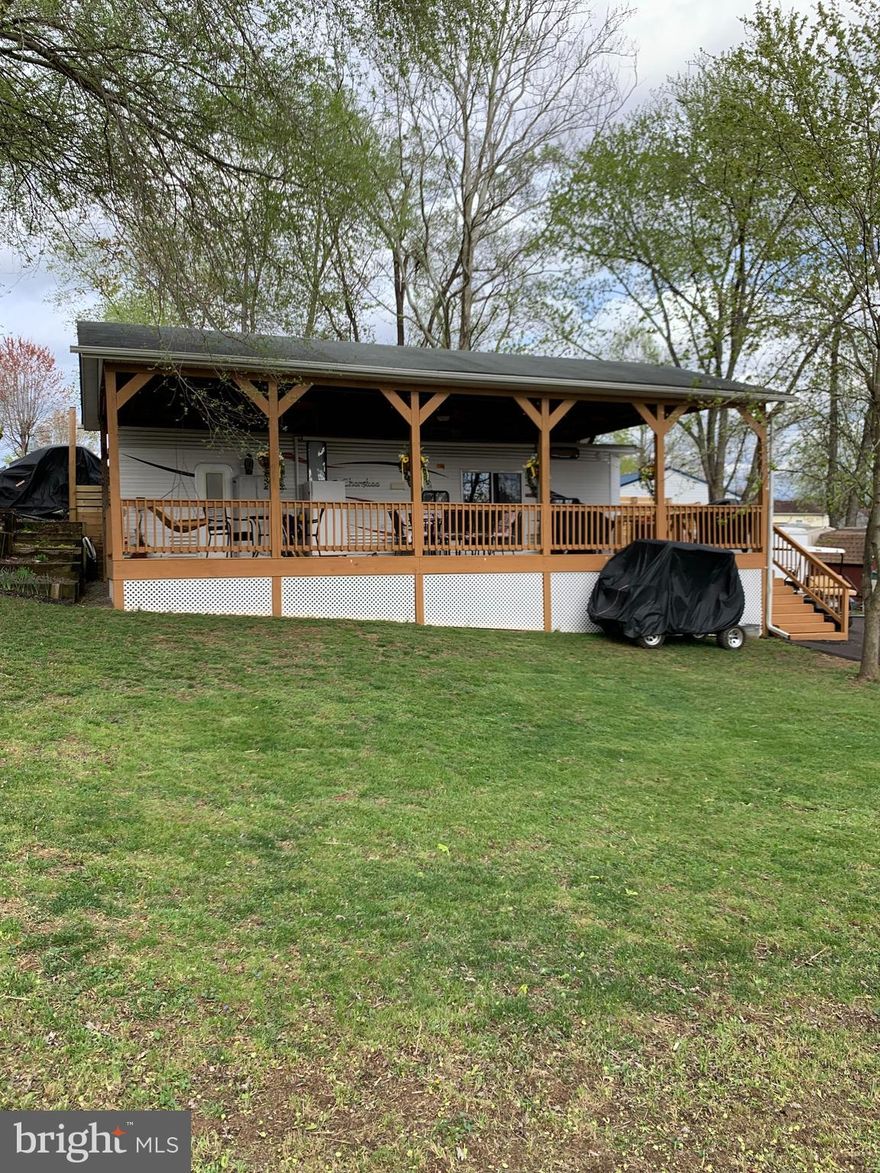 Welcome to River Bend! This property is in excellent condition so all you need to do is relax and enjoy yourself. Very large corner lot. The community has 3 pools, river access, a church, restaurant, general store, bar, youth center, mini golf, etc. Electric & water is included in the annual dues. RV is 40', in excellent condition and has a large covered deck with 3 ceiling fans. Sleeps 8-10. There is a freshly paved asphalt driveway that can fit 4 vehicles easily. Also space for a shed with power already run to the shed location. Please note that the community is open from April-October and not for year round living. Perfect getaway to relax and enjoy yourself!