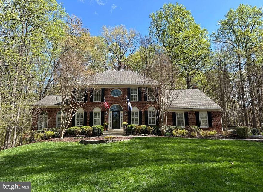 Welcome Home!  This is your rare opportunity to own such a beautiful, classic Virginia colonial nestled on 2 acres in the heart of Fairfax Station. Additional 1.35 acres of adjoining wooded HOA land really lends a park-like estate setting.  ** Stately brick front NV Homes Chapel Hill model with side-load garage and sunroom elevation. ** Turning into the driveway, your first impression curb appeal and approach sight line is simply grand, with a gradual rise up through the trees to your secluded oasis! You and your guests will immediately consider this the finest lot in the neighborhood!  ** Generous extra parking capacity! ** 4 bedrooms, 2 full bathrooms on the upper level; spacious main level includes an office, a large sunroom / conservatory / playroom, and kitchen & family room overlooking a large deck, gazebo, and wooded lot. ** Lower level is perfect for entertaining and awaits your further vision.  ** Enjoy the peace!  Enjoy the privacy!  Enjoy walks/jogs on the South Run Stream Valley Wooded Trail located within the neighborhood.  ** Enjoy the convenience of shopping and dining nearby. **