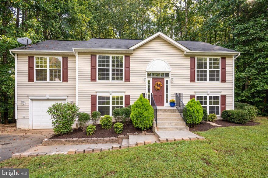 The Walden Team is proud to present 206 Cedar Ridge Drive! WELCOME HOME to this great big split-level located in the amenity-rich community of Lake Land Or. New carpet and paint throughout. 2,300+ finished square feet! 3 bedrooms upstairs (to include Primary suite) and 1 office/bedroom on lower level with a full bath & laundry! Backs to the trees and has a huge, double-level rear deck. Room for the entire family and so much to enjoy! Lake Land Or is a gated community that offers tons of amenities to include two lakes, two pools, beaches, several playgrounds, tennis and basketball courts, skeet and archery ranges, and more! Centrally located between Richmond and DC with easy access to Fredericksburg & Spotsylvania. Easy commute to Quantico or Pentagon using VRE and HOV lots.