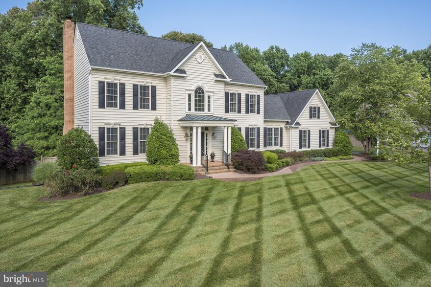 TAKING BACK-UP OFFERS! Coastal Living Perfection on Prime Lot in Koch-built "Nantucket" home! Gourmet kitchen. Large, main floor home office, custom cabinetry & french doors. Great Room, hardwoods, brick FP.  Vaulted master. Basement Versatility w/ BR, Full Bath, 2nd Fam Room, Rec Room, Wet Bar & Storage. Amazing fenced rear yard with play area, paver fire-pit, deck, professional landscaping.