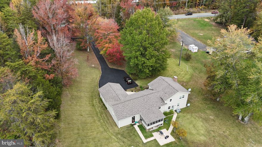 Situated on 1.96 acres, this updated split-level home offers space, flexibility, and no HOA — all while being conveniently located near shopping, dining, and everyday amenities. A property boundary survey was completed in 2025.<br><br> 

Recent updates include a 3-ton HVAC system (2022), water heater (2020), partial driveway repaving (2023), new back garage door (2024), and new front door (2025). The crawl space was encapsulated in January 2026 and includes a sump pump and dehumidifier with a transferable 3-year prepaid maintenance plan. A garage HVAC unit and NuTone intercom system convey as-is, and a zero-turn mower is negotiable.<br><br> 

Enjoy outdoor living with a screened porch and patio, plus a large shed/barn with attached lean-to—fully equipped with electricity for added convenience. The oversized 4-car garage provides ample space for hobbies. <br><br> 

Inside, the kitchen features upgraded countertops, KraftMaid cabinetry, and stainless steel appliances. The bathrooms have been refreshed, and the finished basement offers a versatile recreation space. The wood-burning fireplace has been upgraded with a new liner, cap, and damper. <br><br> 

An assumable 2.625% VA loan is available to qualified VA buyers (subject to lender approval and entitlement substitution). <br><br> 

Conveniently located approximately 13 miles from MCB Quantico and historic downtown Fredericksburg, with a short drive to I-95, commuter routes, shopping, and dining.