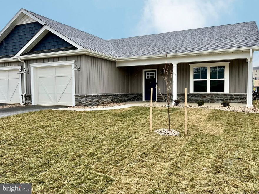 This new home is now finished and ready for a quick move in!  The builder included several upgrades including an expanded 12'x10' rear covered porch, quartz countertops throughout the kitchen and both bathrooms, GE Appliances in a beautiful Slate finish, a ceramic tile backsplash in the kitchen as well as built in blinds in the sliding glass exterior door! 
At 1,395 Sq. Ft. - this 'Maddy' floorplan has an open living area with split bedrooms for extra privacy.  In the Owners Suite, the private bathroom has a dual vanity with a quartz countertop and undermount porcelain bowls, a separate linen closet, large walk-in closet and a 5-foot walk in shower!  Immediately outside of the Owners Suite is an oversized laundry closet.  The 1 car garage is oversized as well, measuring 13'-2" x 20' 8" and includes both a storage closet and a mechanical closet.