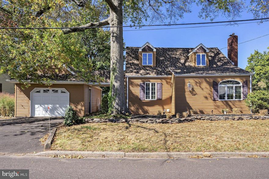 Here’s your chance to own an expanded 3 Bed / 2 Full Bath Cape Cod home with central air and set on nearly half an acre within Pennridge School District in Silverdale!  Enter into the greeting room, which leads to the large living room boasting crown molding, wainscoting, recessed lighting, and built-in shelving and storage.  The spacious main level primary bedroom features a walk-in closet and a bay window.  Next to the primary bedroom is a full bath and a staircase leading to the second floor.  The kitchen is filled with beautiful custom in-set solid wood cabinetry and opens to the bright dining area with a skylight and bay window.  Off the dining area is the grand sunken 2-story family room featuring ceramic tile flooring, a huge wall of floor-to-ceiling windows overlooking the secluded backyard space, a Spanish-style fireplace with a tile inlay surround and a wood mantle, recessed lighting, and an elegant spiral staircase.  Upstairs, you’ll find two additional nicely-sized bedrooms and a full bath. The partially finished basement has a laundry area and is a great space for storage. Outside, enjoy the fully fenced backyard and large paver patio - perfect for your outdoor entertaining needs.  There is a covered breezeway connecting the home to the detached oversized 1-car garage that has rear garage door access - convenient for your lawn mower or yard equipment.  Located near schools, shopping, dining, and Route 309. Property is sold as-is.  Don’t miss your opportunity to see this home - schedule your showing today!