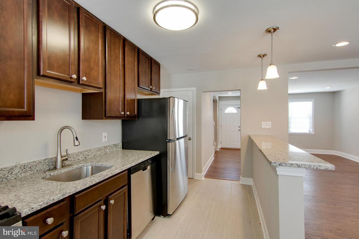 "The Wildwood" is designed with style and class. Enjoy the open floor plan,well designed kitchen with stainless steel energy efficient appliances & 42 inch cabinets and gorgeous solid hardwood floors. The lower level is spacious with a full custom designed master bath. Great yard for entertaining. Spacious and affordable with your buyer in mind.