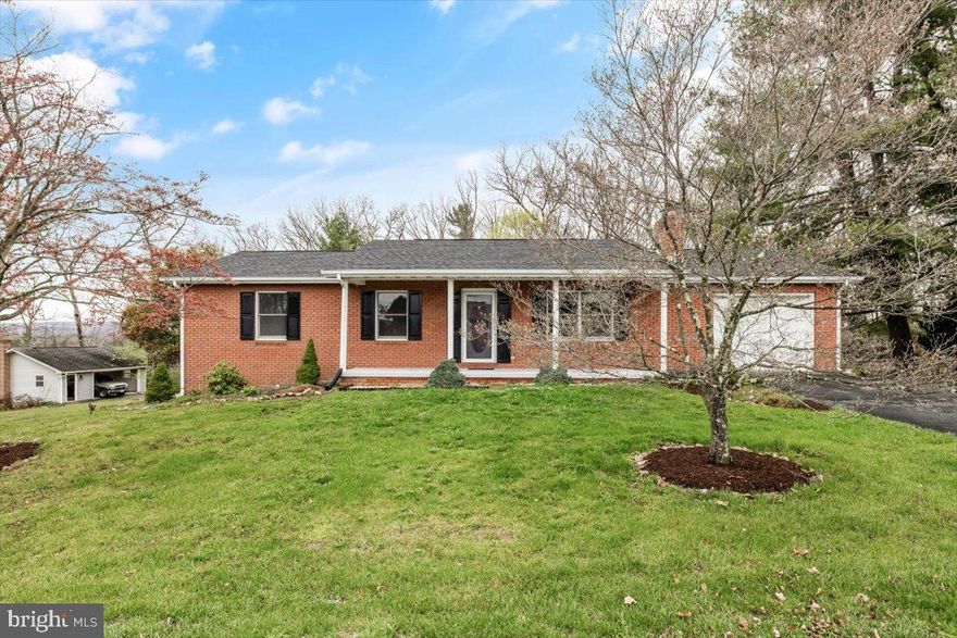 Welcome to 260 Hill Crest Drive, nestled just over the county line in the peaceful town of Capon Bridge, West Virginia. Only 26 minutes from the heart of downtown Winchester, this adorable 4-bedroom, 2.5-bathroom rancher is a perfect blend of modern amenities and serene country living. The updated kitchen features modern appliances, and the spacious living room boasts a large wood-burning fireplace—ideal for cozy evenings. The home is also equipped with a propane-powered wall furnace heater (with a full tank), two refrigerators (one new and one in the attached garage), and convenient window blinds in the main bedroom for added privacy.

For those who love outdoor living, the property is a true gem. The beautifully landscaped yard is bursting with colorful spring and summer flowers, lilacs, and fragrant herbs, along with flowering trees such as the stunning Kousa dogwood. Enjoy leisurely afternoons with horseshoe pits, scenic wooded trails, and an amazing sunset view. A charming treehouse/playhouse adds a whimsical touch to the property, while a small exterior shed provides additional storage space. One of the standout features of the outdoor area is a stone paver pad with an electric outlet, perfect for plugging in a hot tub for ultimate relaxation.

Capon Bridge also offers nearby recreational spots like **The Farmer’s Daughter**, a beloved local spot known for its delightful homestyle meals, and **River House**, a popular destination offering great food and river views. These spots provide excellent opportunities for both relaxation and community engagement, making this location even more desirable.

Inside, the attached garage comes with a garage door opener, and the large detached 2-car garage is equipped with a wood stove, perfect for staying warm during the colder months. Additionally, the home is equipped with a water softener, and the basement has been set up with a dehumidifier for preventative care.

For those considering a home-based business, the detached garage offers separate electrical service (with two accounts), and the finished basement includes a spacious office area with a separate entrance. Please note, all business use must be approved by the landlord, and retail operations, storefronts, customer visits, or business-related parking/storage are strictly prohibited to maintain the peaceful residential nature of the property.

This home is served by Potomac Edison for electricity, a well and septic system, and offers internet options through Frontier or Starlink. With backup heat sources including the wood-burning fireplace, electric baseboard heat, and the wall furnace heater in the basement, you’ll be comfortable no matter the season.

As with any rental, renters insurance is required. The propane tank for the fireplace in the basement must be returned full, or security deposit funds will be used for refilling. The fireplace has been inspected annually, and radon mitigation has been installed for your peace of mind.

Whether you’re seeking tranquility, a potential business location, or access to nearby recreational spots, 260 Hill Crest Drive is the perfect place to call home.