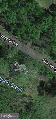 This lush home site is just under an acre and is the perfect place for your dream home or getaway! Beautiful mature trees cover the property and Mill Creek runs through it (and it's stocked with fish frequently by the DNR!). There's a nice building site out of the floodplain. Close to amenities and a great commuter location to VA. The owner is also offering C-40 Currency and C-39 Currency if you're looking for more land, and the seller will consider financing with 20% down (with a seller- approved credit report). Lightly restricted. Call now!
