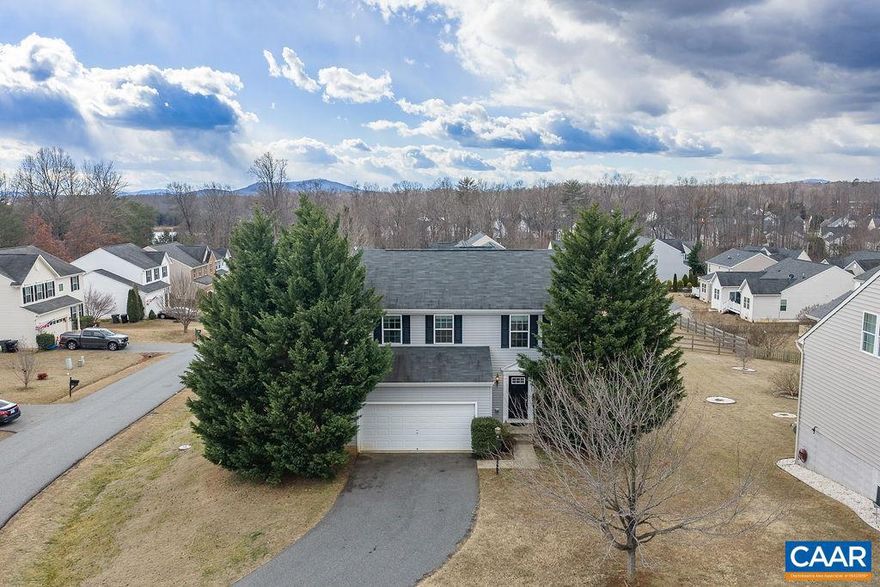 Nestled in popular Greenecroft, this light and bright colonial home awaits its next owner. The open plan includes the living room, dining area, and kitchen, which features granite counters, island, large pantry, stainless appliances, and hardwood floors. The upper level has three bedrooms, with the primary bedroom including a spacious walk-in closet and private bathroom. Basement is a great set up for a fourth bedroom (or use as a rec space) and a large, unfinished room which can be finished off or kept as excellent storage. The dining area opens onto the back deck (recently installed), which overlooks the level yard - perfect for gardening, pets, play, and entertaining. Two car garage. Near shopping and restaurants. Only 25 minutes to Charlottesville / UVA, 10 minutes to NGIC, 15 minutes to the airport.,Granite Counter