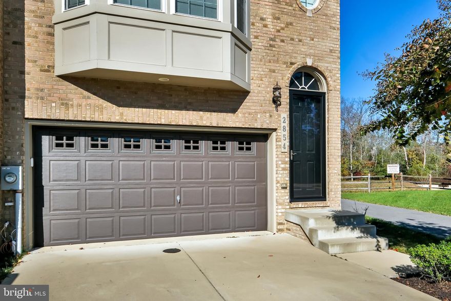 This home is ready for its' new owner, and ready to close before the New Year. A gorgeous end unit townhome features 3 bedrooms, 2 full bathrooms on the upper level, with a washer/dryer hook up. Large open floor plan on the main living area and 1/2 bathroom.  Enjoy your beautiful gourmet kitchen with stainless steel appliances; gas stove, double oven, microwave, refrigerator, large island and eat in kitchen that flows to the rear deck.  The home has been freshly painted and all flooring  (1/2 carpet and 1/2 LVP) is newly installed. The lower level has an open recreation area, 1/2 bathroom, walk out to a brick patio and 2 car garage. The home also has a multi media system installed.