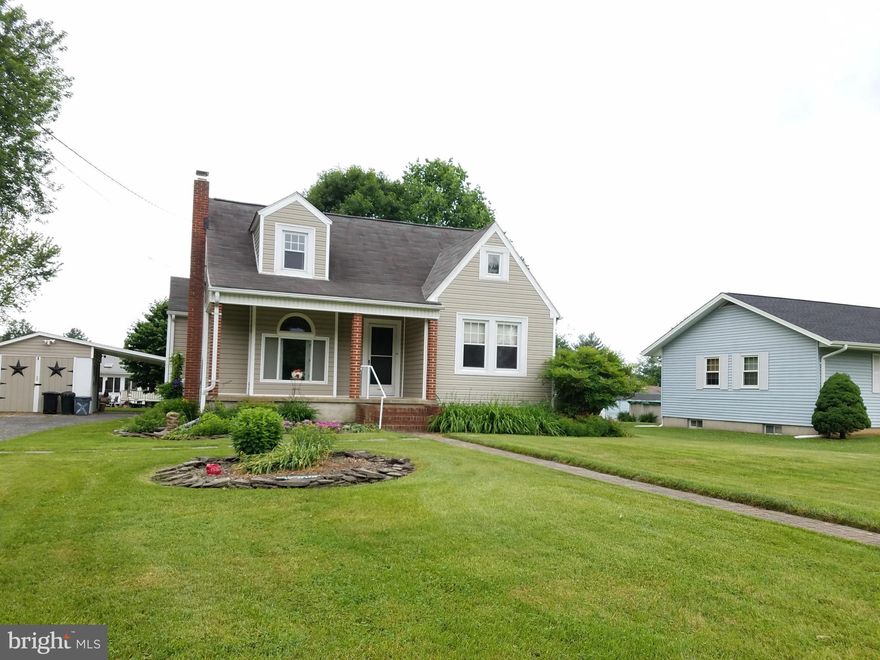 Come see this updated Cape Cod in a water oriented community. Vaulted wood plank ceilings in the kitchen and hard wood flooring in some of the rooms. The bathroom has been updated in recent years too. Great master bedroom on the second level. Enjoy the covered porch and rear patio area.  There is also a detached garage with a carport area. Full unfinished basement which is great for storage.