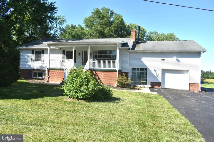 Rural Living, but with convenient access to Rt. 15 and only 10 minutes from downtown Frederick.  Situated on a beautiful 1.69 acre lot, you will fall in love with the peaceful, scenic setting, enjoying the large covered front porch and the private patio in the rear yard. This rancher has been well maintained with hardwood floors in the living & dining room, hallway and all 3 bedrooms.  The 18' x 14' living room is light & bright and the dining room has extensive built-in cabinetry.  The kitchen has ample cabinets and opens to a sunroom that captures views of the rear yard. The lower level of this rancher is full finished and has two huge rooms, each measuring approximately 24' x 21'.  This level has another full bath and the washer & dryer with an outside access. Heating is oil forced air and there is central air conditioning, plus electric baseboard head. Just a few notes: The tenant must mow and maintain the 1.69 acre lot. but the owner will provide a riding mower for tenants use. There are 2 large sheds that the owner stores items inside and cannot be used by the tenants. No Pets allowed. Credit scores must be 650 and above. No smokers. 2-year minimum lease required.