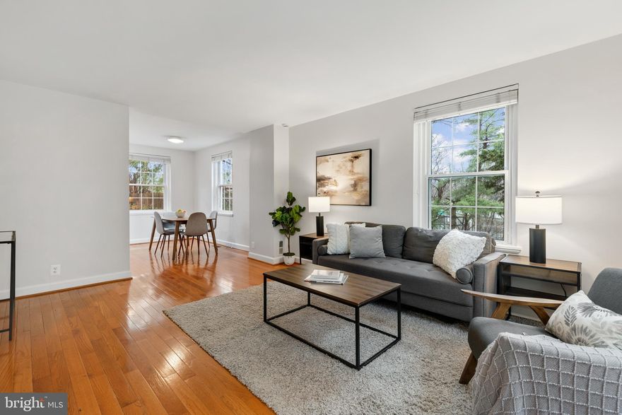 Gorgeous 2-bedroom, 2-bathroom Clarendon I model end-unit townhome nestled in Fairlington Villages! A convenient coat closet welcomes you at the entry, along with gleaming hardwood floors that extend throughout the main & upper levels. The spacious, freshly painted, living room flows effortlessly into a separate dining area with overhead lighting. The kitchen features updated cabinetry with modern pulls, quartz countertops, a tile backsplash, & stainless steel stove, microwave, & dishwasher. Just off the kitchen, step outside to the private fenced patio - perfect for relaxing, grilling, or enjoying time outdoors. Upstairs, the freshly painted hallway offers overhead lighting and a linen closet for added storage. The beautifully updated bathroom features an oversized quartz-topped vanity & a sparkling white subway-tiled shower with soaking tub & niche shelving. The spacious primary bedroom includes a ceiling fan with overhead lighting & a wall-to-wall walk-in closet. The second bedroom is filled with natural light from windows on two walls and includes a closet with shelving for excellent organization.

The renovated lower level boasts tall ceilings, recessed lighting, & wood-look tile flooring throughout the large recreation room & bonus room. The rec room features wall-to-wall custom built-in cabinetry with a charming soft-close bench seat with storage, along with full-size daylight windows with plantation shutters that allow natural light to fill the space. Additional highlights include under-stair storage with a newer water heater (2023), a versatile bonus room - perfect for guests or a home office - and a full bathroom with pedestal sink, corner shower with sparkling white subway tile & niche shelving. A laundry nook with a full-size washer & dryer and overhead shelving adds convenience to this level. This home comes with 2 reserved/unassigned parking spaces. Fairlington Villages residents enjoy six pools, lighted tennis courts, tot lots/playgrounds, walking paths, and MORE! Ideally located near I-395 and the shops & restaurants at The Village at Shirlington, West Alex, Baileys Crossroads, Del Ray, & Old Town.