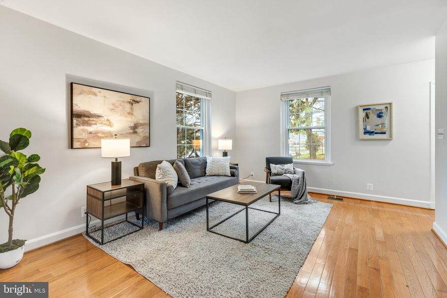 Gorgeous 2-bedroom, 2-bathroom Clarendon I model townhome nestled in Fairlington Villages! One of only four Clarendon homes on the north side offering 1,500 sq ft of living space, this bright & sunny end unit enjoys southern exposure that fills the home with natural light throughout the day, along with double-pane windows that help keep the interior quiet & comfortable. The lower level also features full-size daylight windows, bringing exceptional natural light into the basement.

A convenient coat closet welcomes you at the entry, along with gleaming hardwood floors that extend throughout the main & upper levels. The spacious, freshly painted living room flows effortlessly into a separate dining area with overhead lighting. The kitchen features updated cabinetry with modern pulls, quartz countertops, a tile backsplash, & stainless steel stove, microwave, & dishwasher. Just off the kitchen, step outside to the private fenced patio - perfect for relaxing, grilling, or enjoying time outdoors.

Upstairs, the freshly painted hallway offers overhead lighting and a linen closet for added storage. The beautifully updated bathroom features an oversized quartz-topped vanity & a sparkling white subway-tiled shower with soaking tub & niche shelving. The spacious primary bedroom includes a ceiling fan with overhead lighting & a wall-to-wall walk-in closet. The second bedroom is filled with natural light from windows on two walls and includes a closet with shelving for excellent organization.

The renovated lower level boasts tall ceilings, recessed lighting, & wood-look tile flooring throughout the large recreation room & bonus room. The recreation room features wall-to-wall custom built-in cabinetry with a charming soft-close bench seat with storage, along with full-size daylight windows with plantation shutters that allow natural light to fill the space. A versatile bonus room - perfect for guests or a home office - and a full bathroom with pedestal sink, corner shower with sparkling white subway tile & niche shelving, & a laundry nook with a full-size washer & dryer and overhead shelving adds convenience to this level. Other home features include a newer water heater (2023) and two reserved/unassigned parking spaces. Fairlington Villages residents enjoy six pools, lighted tennis courts, tot lots/playgrounds, walking paths, and MORE! Ideally located near I-395 and the shops & restaurants at The Village at Shirlington, West Alex, Baileys Crossroads, Del Ray, & Old Town.