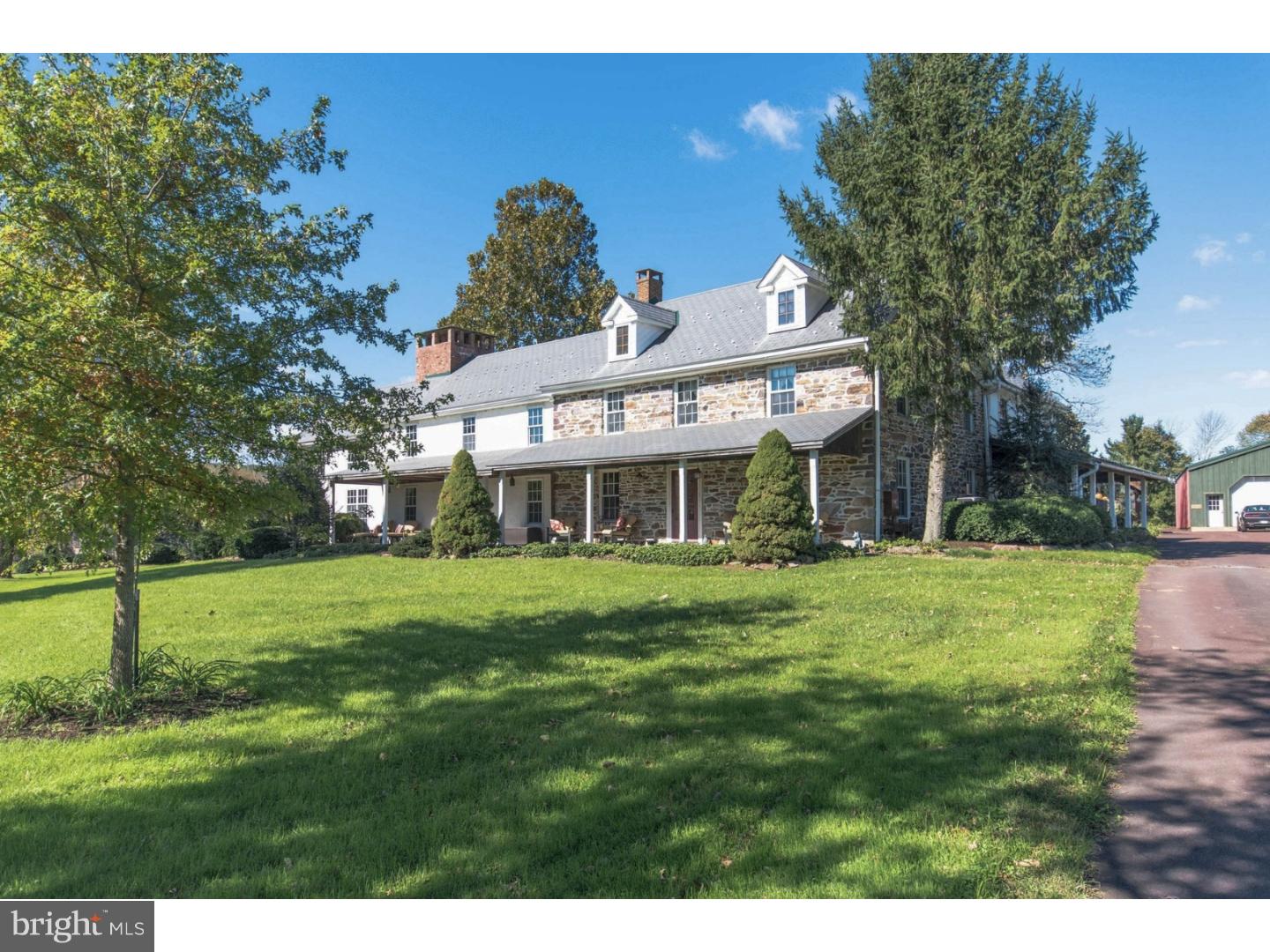 SALE PENDING. An approach from a long expanse of driveway, past a glistening pond, is the introduction to this impressive countryside estate. A grand 1737 farmhouse, useful outbuildings, and unparalleled stillness and beauty on 23 acres comprise Heacock Valley Farm. Wide plank pine floors, beamed and cathedral ceilings, and exposed stone walls bring warmth and character to gracious rooms. Mercer tiles adorn wood burning fireplaces in nearly every room. Soaring windows in the stunning terrace room span two levels and provide panoramic vistas of the grounds. A charming library is tucked way behind arched doors, the perfect escape for a quiet read. 5 bedrooms and 4 full baths easily accommodate guests for unforgettable holiday and weekend retreats. Superior amenities are revealed walking the peaceful land where a swimming pool, guest space, heated workshop, hunting cabin and storage hangar are found. The location is central to plentiful dining, shopping and recreational options in the nearby Lehigh Valley and picturesque towns along the Delaware River. Nockamixon State Park borders the setting with thousands of unspoiled acres preserved for hiking, biking, and boating.