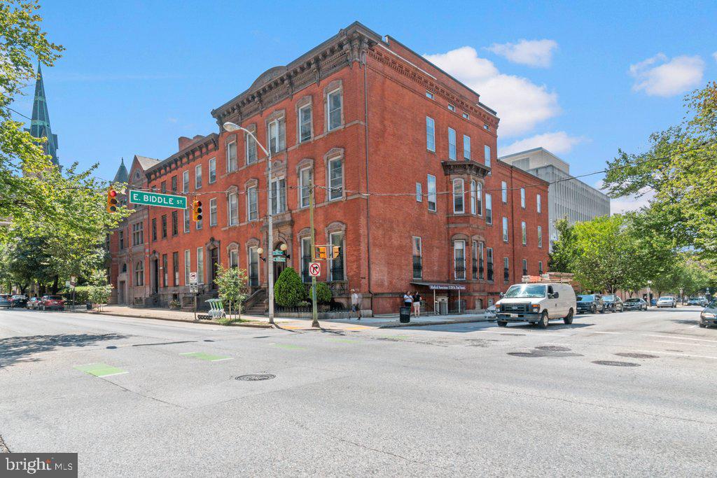 Unit 3 spans 3,571 sq. ft. across 16 rooms and two half baths, presenting an exceptional opportunity for medical, wellness, or professional users seeking substantial space in Baltimore City. With a private entrance from Biddle Street and a layout originally designed for a physical therapy practice, the suite already functions well for exam rooms, consultation offices, or treatment areas.
The configuration supports both private and collaborative use, offering smooth flow between rooms while preserving patient or client privacy. The generous footprint also lends itself to creative or hybrid live/work adaptation with the addition of a kitchen.
Monthly condo fee is $1,131.12.
Unit 3 connects internally to Unit 1, creating approximately 5,508 sq. ft. of contiguous space with multiple exterior entrances — ideal for a growing group practice, multidisciplinary clinic, or owner-user seeking a large, customizable environment within historic Mount Vernon.
The History
What began as a small physical therapy office in the lower level soon grew to meet rising demand. As the practice expanded, additional rooms were added to accommodate more patients, staff, and specialized treatments.
The doctors maintained their private offices in the parlor-level suites above, where they met with patients for long-term care planning, welcomed medical representatives, and collaborated with fellow physicians. Together, the connected spaces evolved into a cohesive professional environment — purpose-built for care, collaboration, and growth — while preserving the elegance and architectural presence that define Mount Vernon’s historic townhouses.