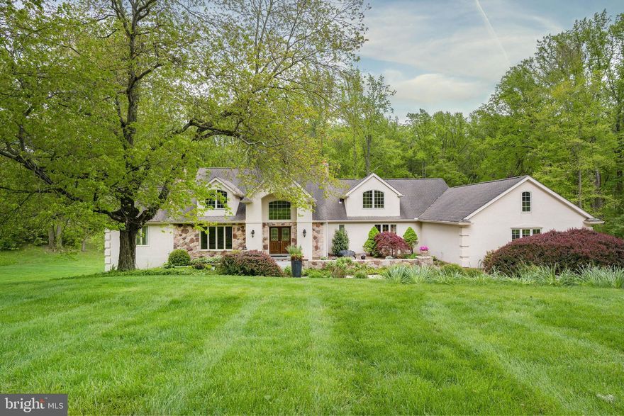 This stunning and impeccably maintained 4 bedroom, 3 full/3half bath home is situated on a picturesque 4+ acre lot in Pennsbury Township, located within the Unionville-Chadds Ford school district.  Nature abounds as you approach this lovely home from a quiet, secluded drive with lush, mature landscaping and pond views.  Stepping into the grand two story foyer, you'll immediately notice the abundance of natural light and wonderful views from every room. This home is an entertainer's dream with formal living and dining areas and an open concept kitchen/family room area with walls of windows and 2 sets of French doors leading to the rear Trex deck.  Notable features in the chef's kitchen are  a 48" Sub Zero refrigerator, 6 burner Dacor gas range, Bosch dishwasher and a large island containing a Jenn-Air oven.. The large family room area has vaulted ceilings, a gas fireplace and gorgeous views of your own private pond and gazebo. You'll also find a handsome main level office with a gas fireplace and wet bar. The first floor also includes the primary bedroom suite, a retreat complete with  brand new carpeting, sitting area, large walk in closet and luxurious ensuite bath.  Upstairs, there is another spacious and private bedroom suite with a full bath and large closet.  Also on the second floor are 2 more generously sized bedrooms, a large bonus room and a full bath with double sinks and shower/tub combo.  The lower level offers even more space for entertaining, and features a large, light filled recreation room with 2 sets of doors leading to the back yard. There is also an exercise area and powder room on this level.  The attached and turned, oversized 3 car garage is perfect for all your storage needs. This magnificent home will not disappoint!