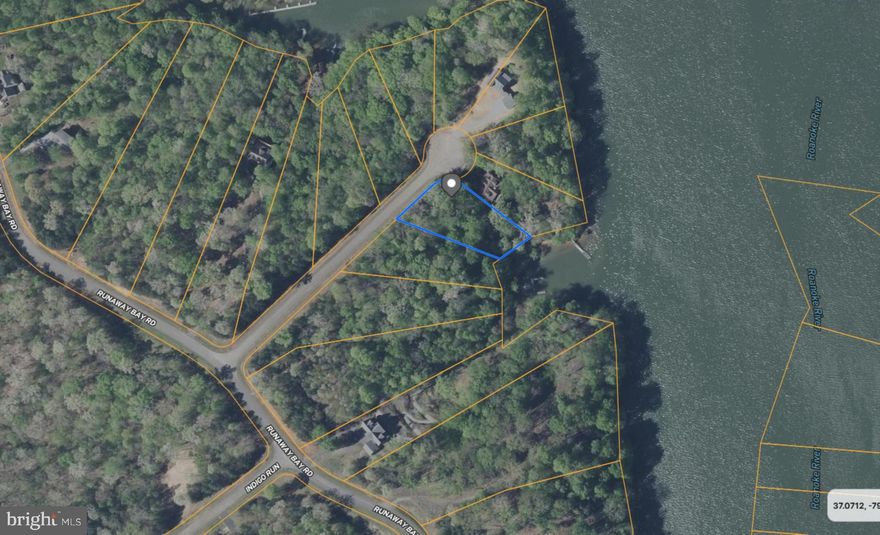 WOWZA, this property offers a comprehensive array of features. It boasts direct waterfront access, scenic views, lake access, and breathtaking mountain vistas. Additionally, I must emphasize the waterfront aspect. Prospective buyers should act swiftly, as this opportunity is likely to be claimed quickly. This is an excellent value in a highly desirable location. While it is situated near Smith Mountain Lake (SML), it is located on Leesville Lake within the esteemed community of Runaway Bay. I am quite interested in this property myself, so prompt action is advised. The community features a private dock, a pavilion, and a designated picnic area. It is positioned at the end of a cul-de-sac. Consider bringing your boat, fishing equipment, and swimwear, and do not forget to prepare your building plans. Approximately 85 feet of waterfront shoreline is included with this property.