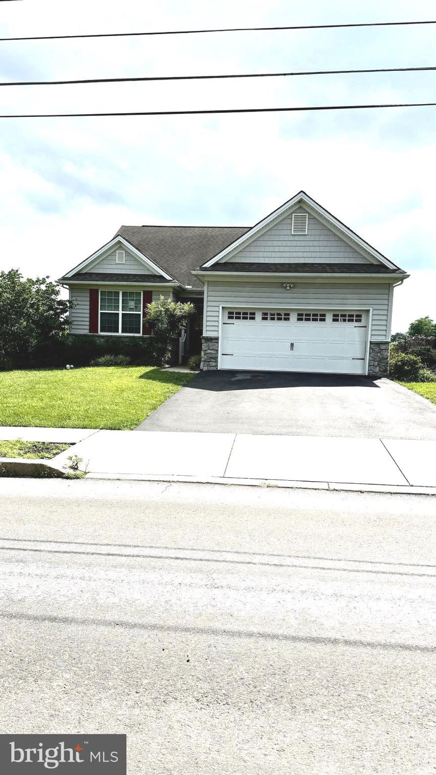 newer single family detached home on level lot. Large Great room with sliding glass doors leading to big deck with awning,, fully equipped  Kitchen with eat in counter tops,  2 bedrooms with connecting bath, office/den with large  closet adjacent to full bath, separate laundry room , interior access from garage, Full basement exterior  light from large window.  2 car garage with electric garage door opener.  additional 2 driveway parking spaces. Gas hot air heat, central air conditioning, public water & sewer. Available for quick occupancy.